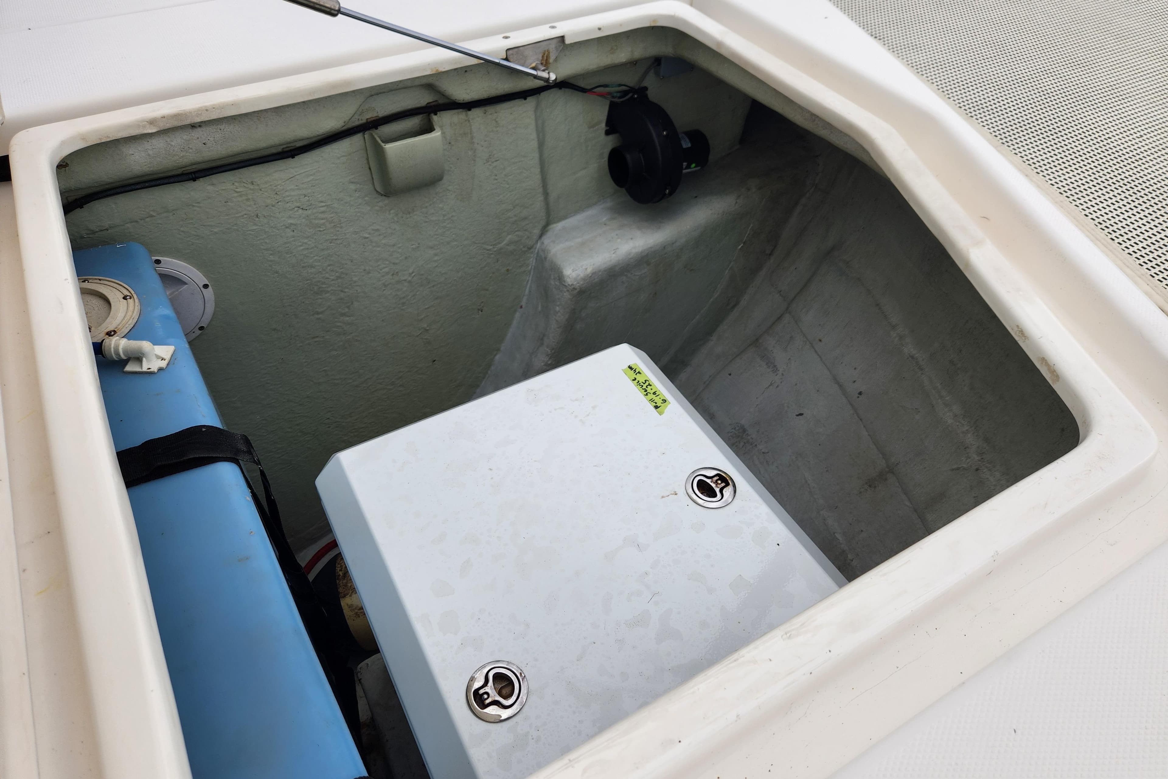 Compartment of 2015 Leopard 44 boat showing storage and equipment.