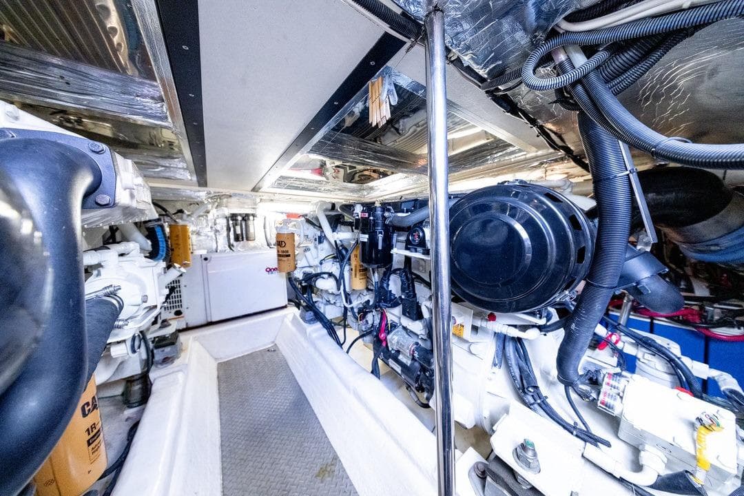 Engine room of 2006 Riviera 47 Open Flybridge Series II yacht, showcasing machinery and components.