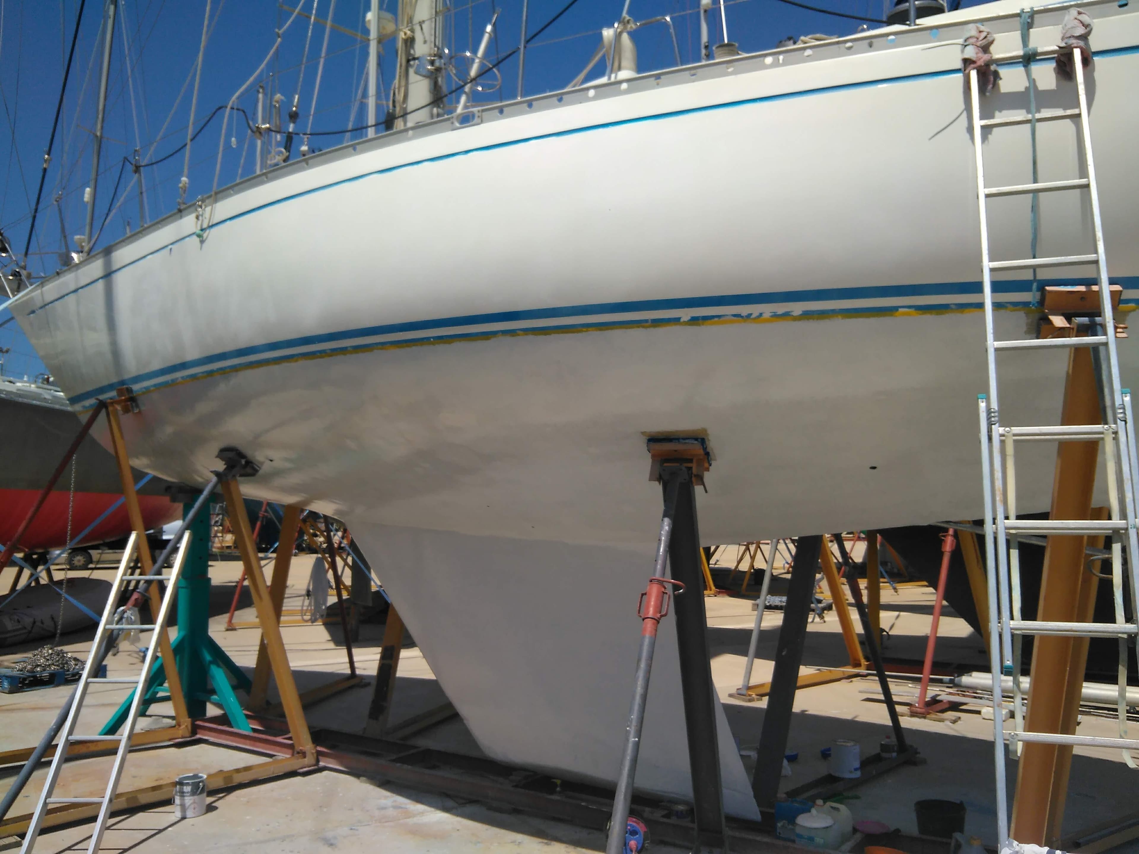 1977 Nautor Swan 411 sailboat on dry dock with visible keel and support stands.