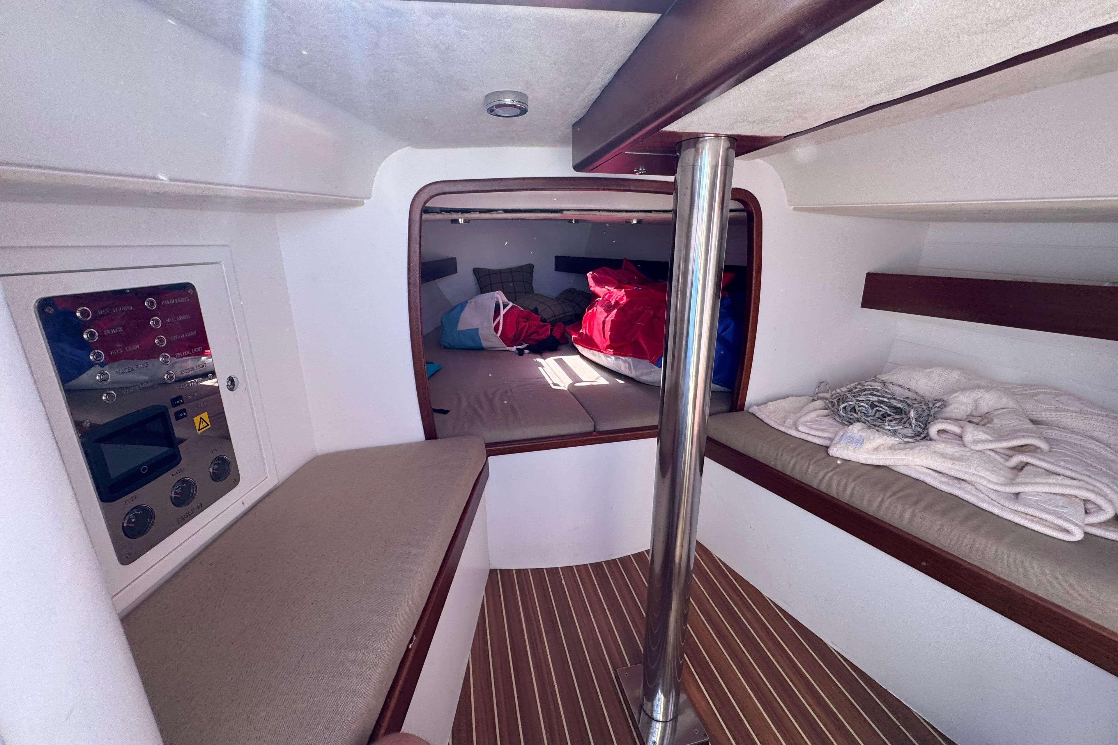 2018 Leonardo Yachts Eagle 44 cabin interior with cozy bedding and control panel.