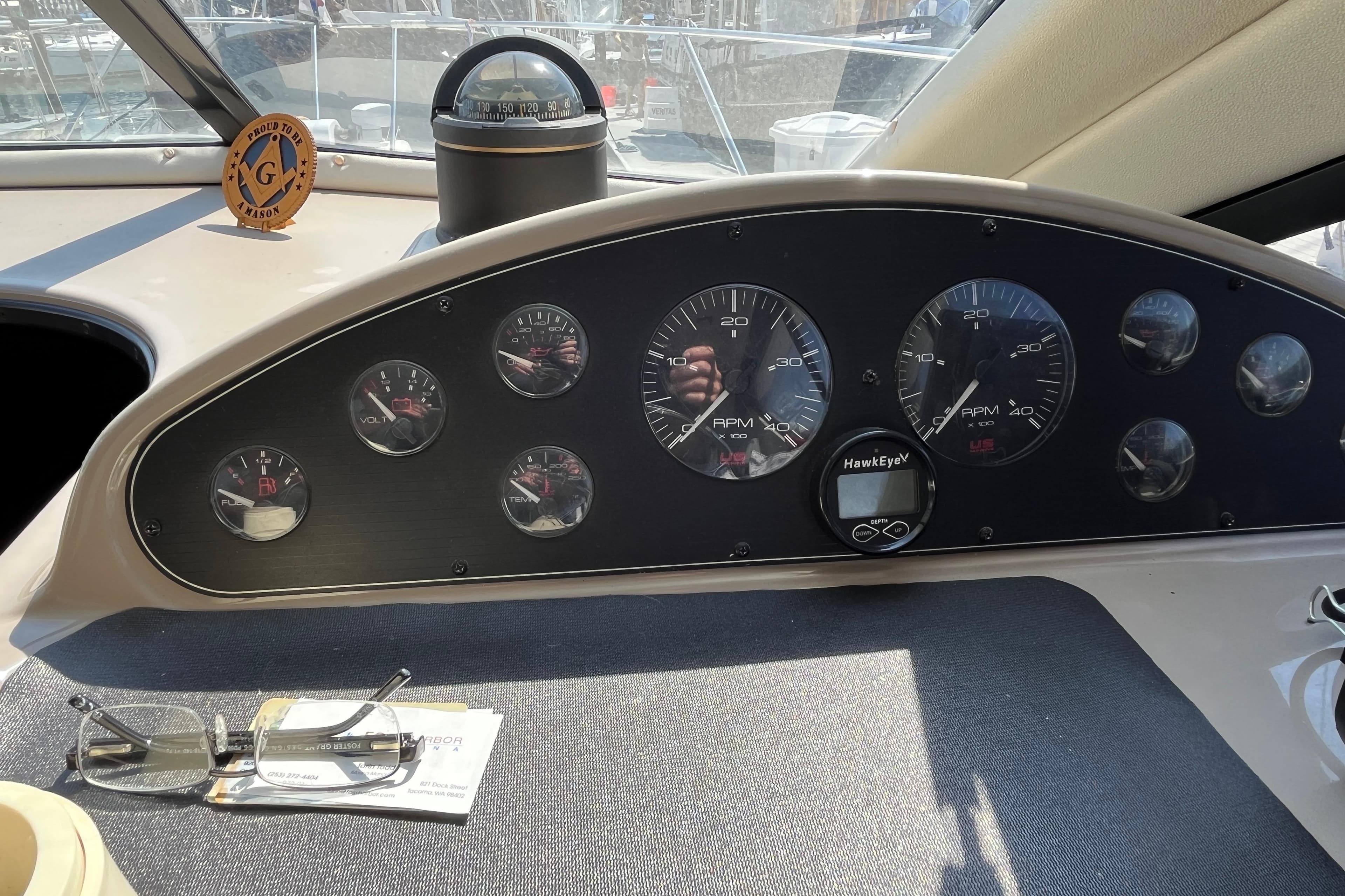 1996 Bayliner 3788 Command Bridge Motoryacht dashboard with gauges and compass.