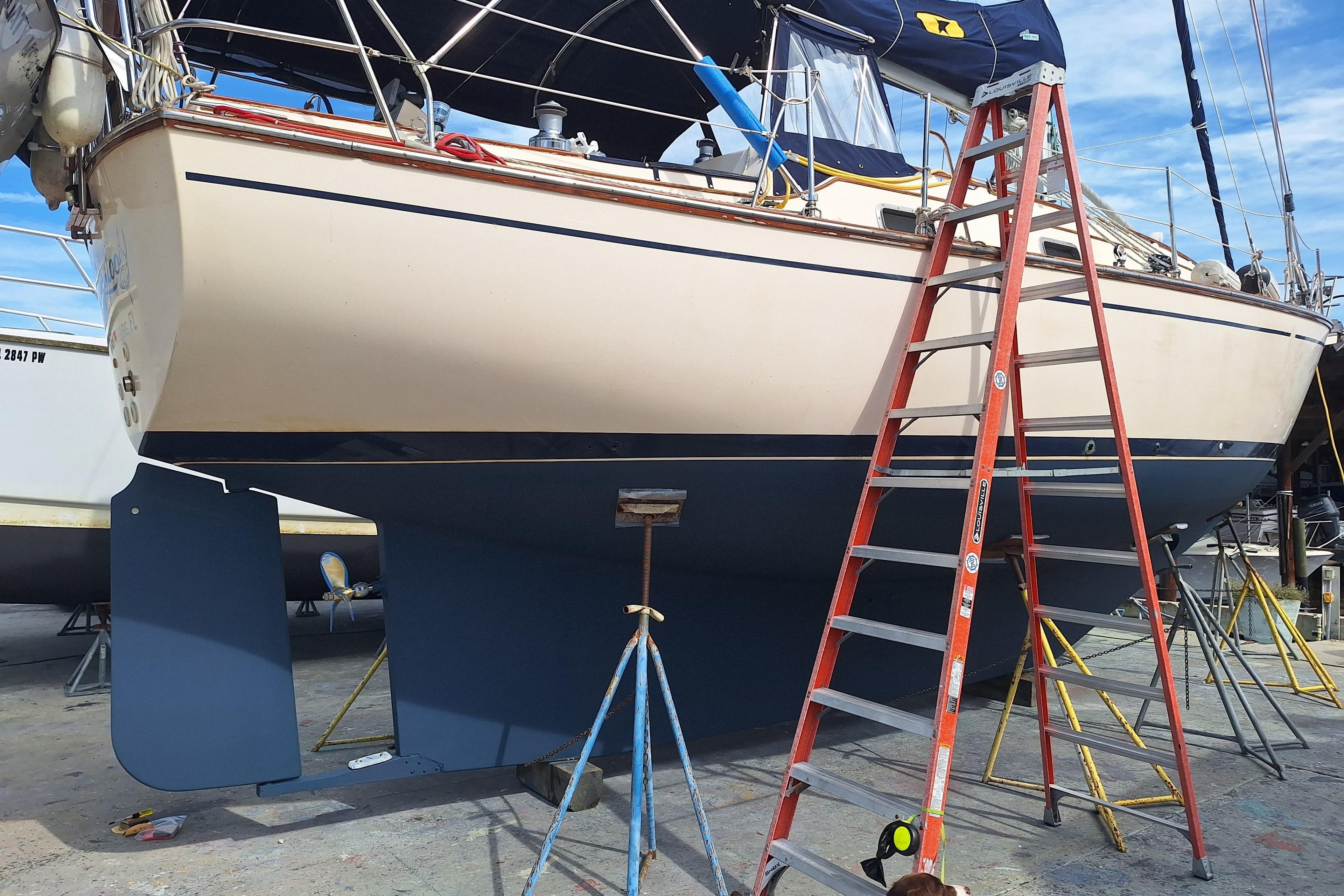 1996 Island Packet 40 sailboat on dry dock with ladder and supports.