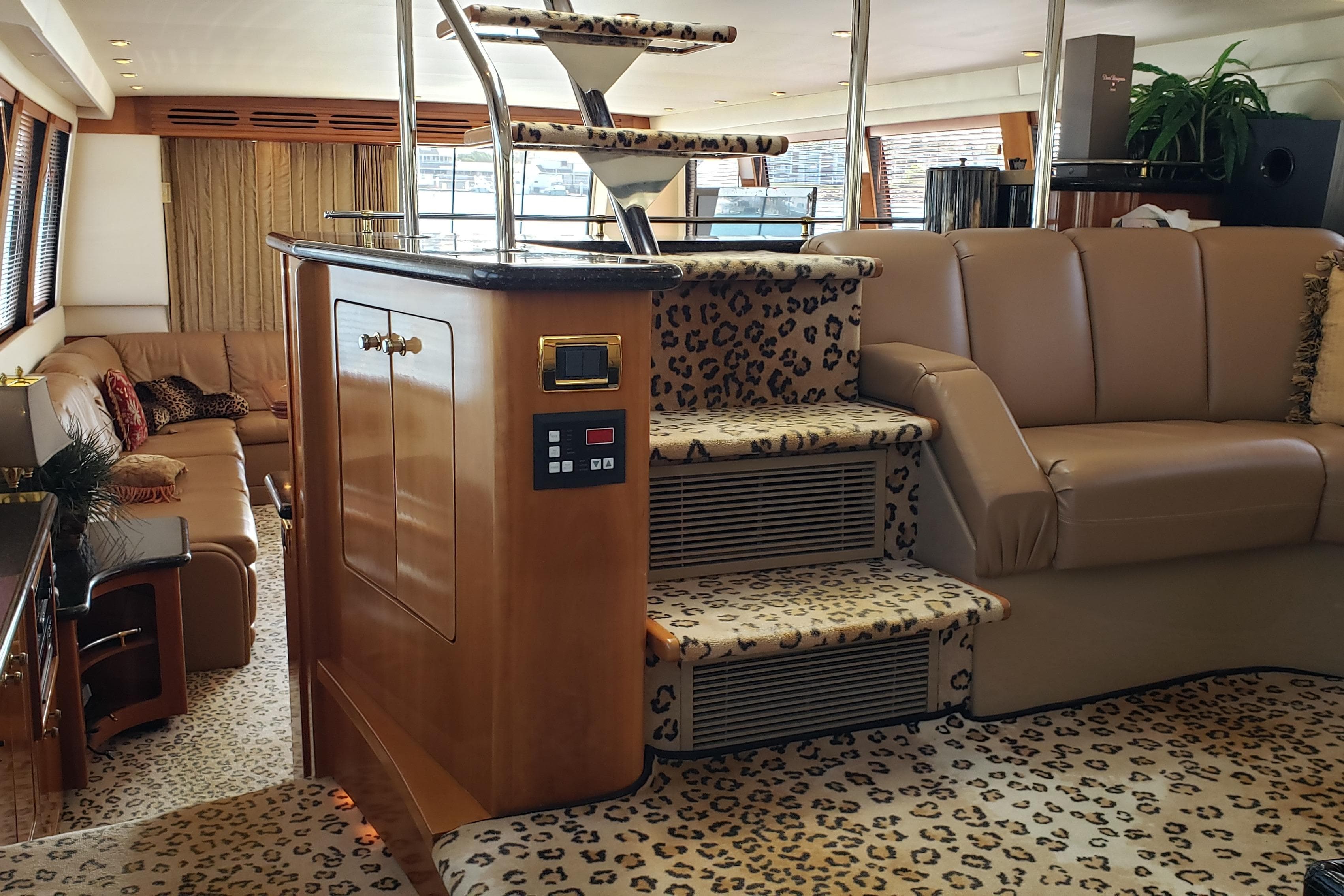 Luxurious interior of 2002 Carver 570 Voyager Pilothouse with leopard print decor.