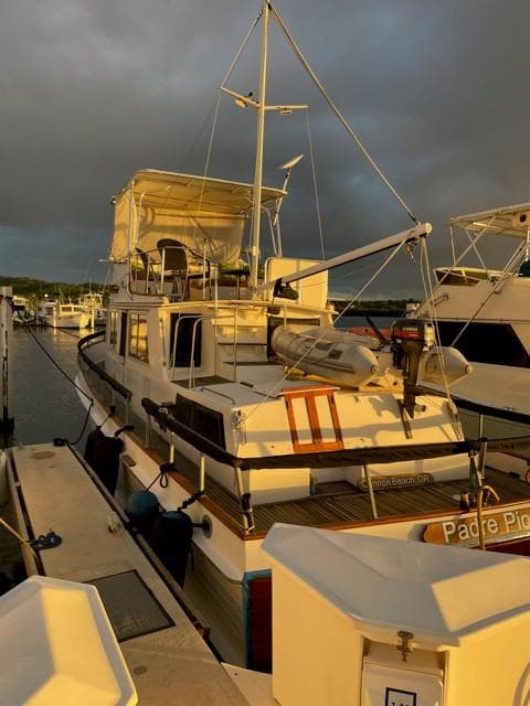 1986 Grand Banks 42 Classic docked at sunset.