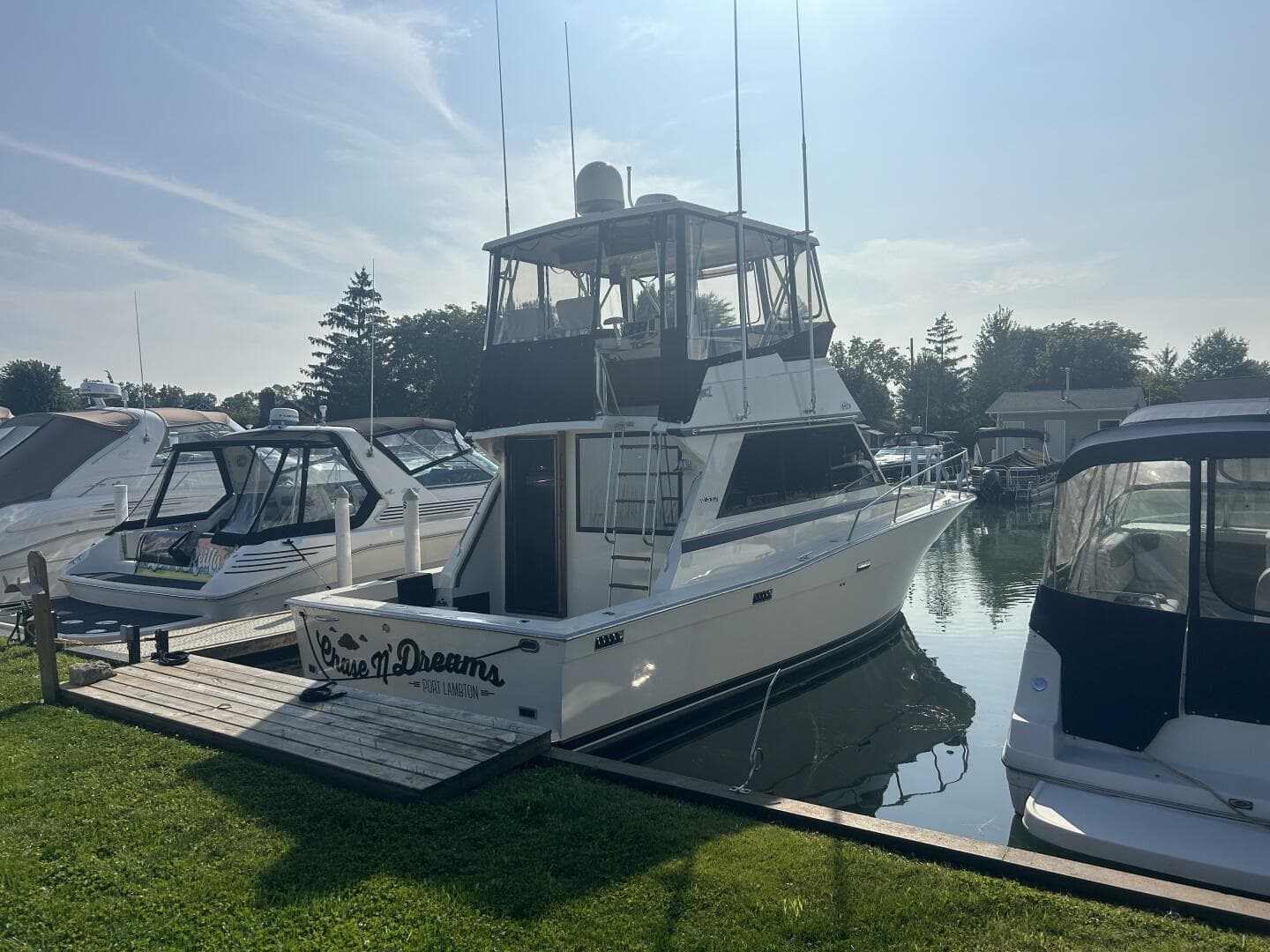 1986 Viking Boats 35 Convertible docked in a marina under clear skies.
