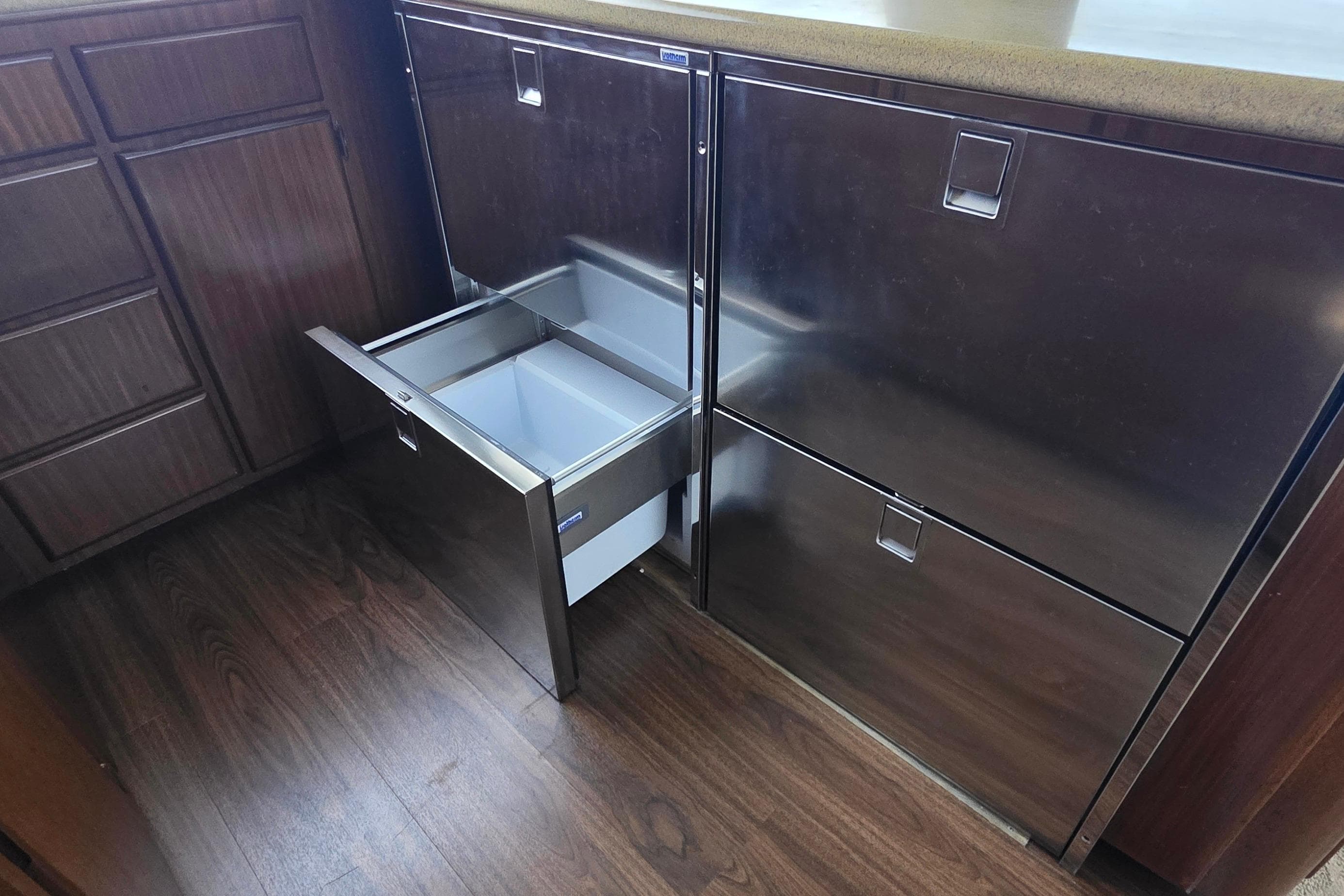 Stainless steel drawer in 1989 Hatteras 52 Convertible yacht kitchen interior.