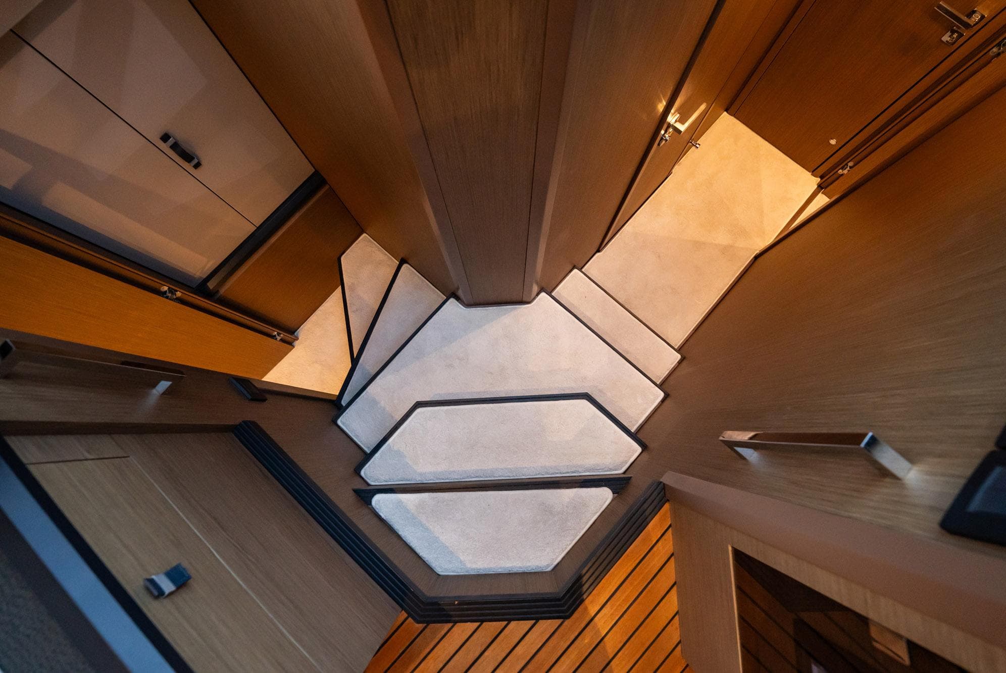 Interior view of 2021 Beneteau Monte Carlo 52 yacht, showcasing modern stair design.