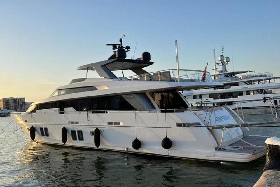 2016 Sanlorenzo SL96 yacht docked at sunset.