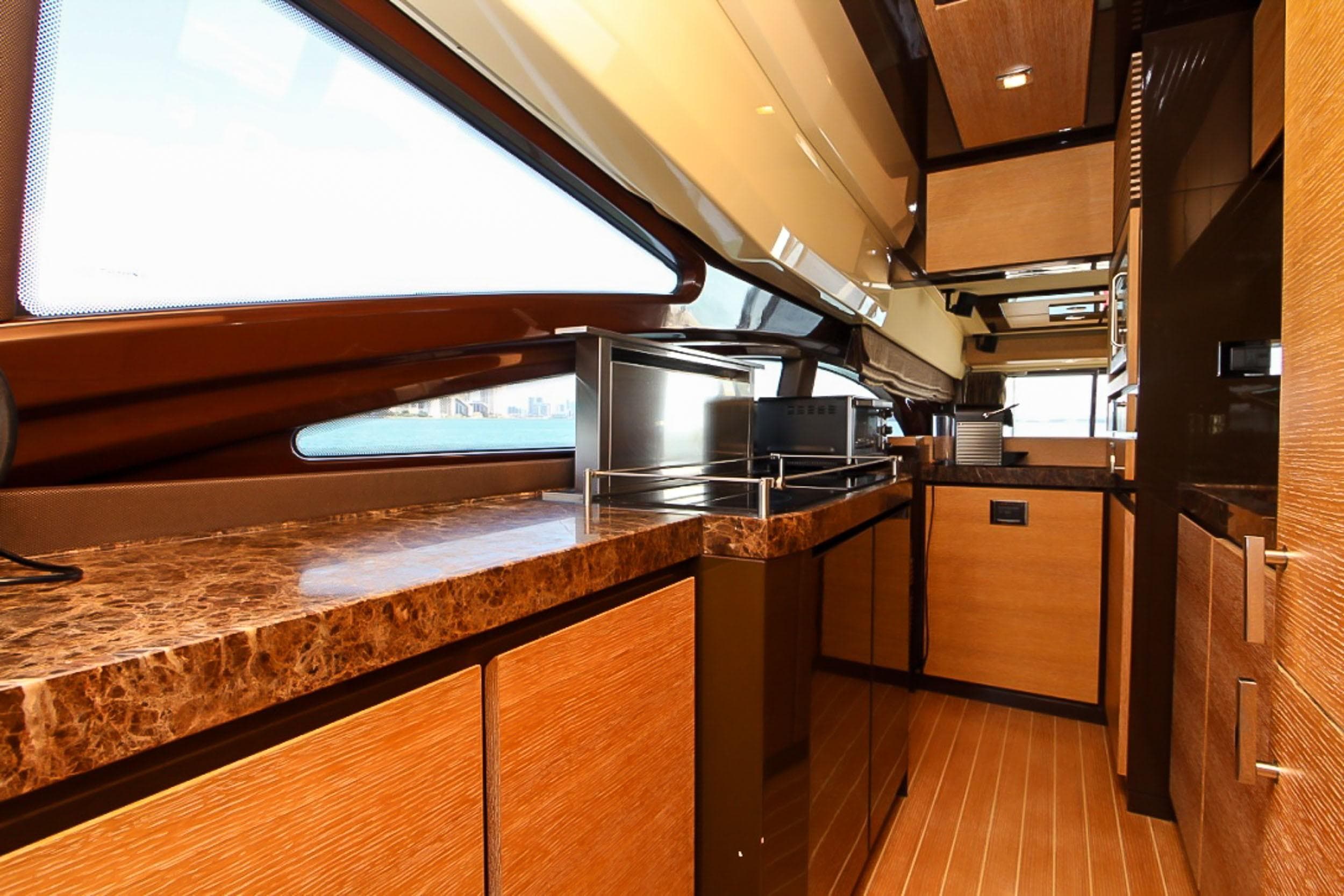 Luxurious interior of a 2011 Azimut 70 yacht with sleek wood finishes and modern design.