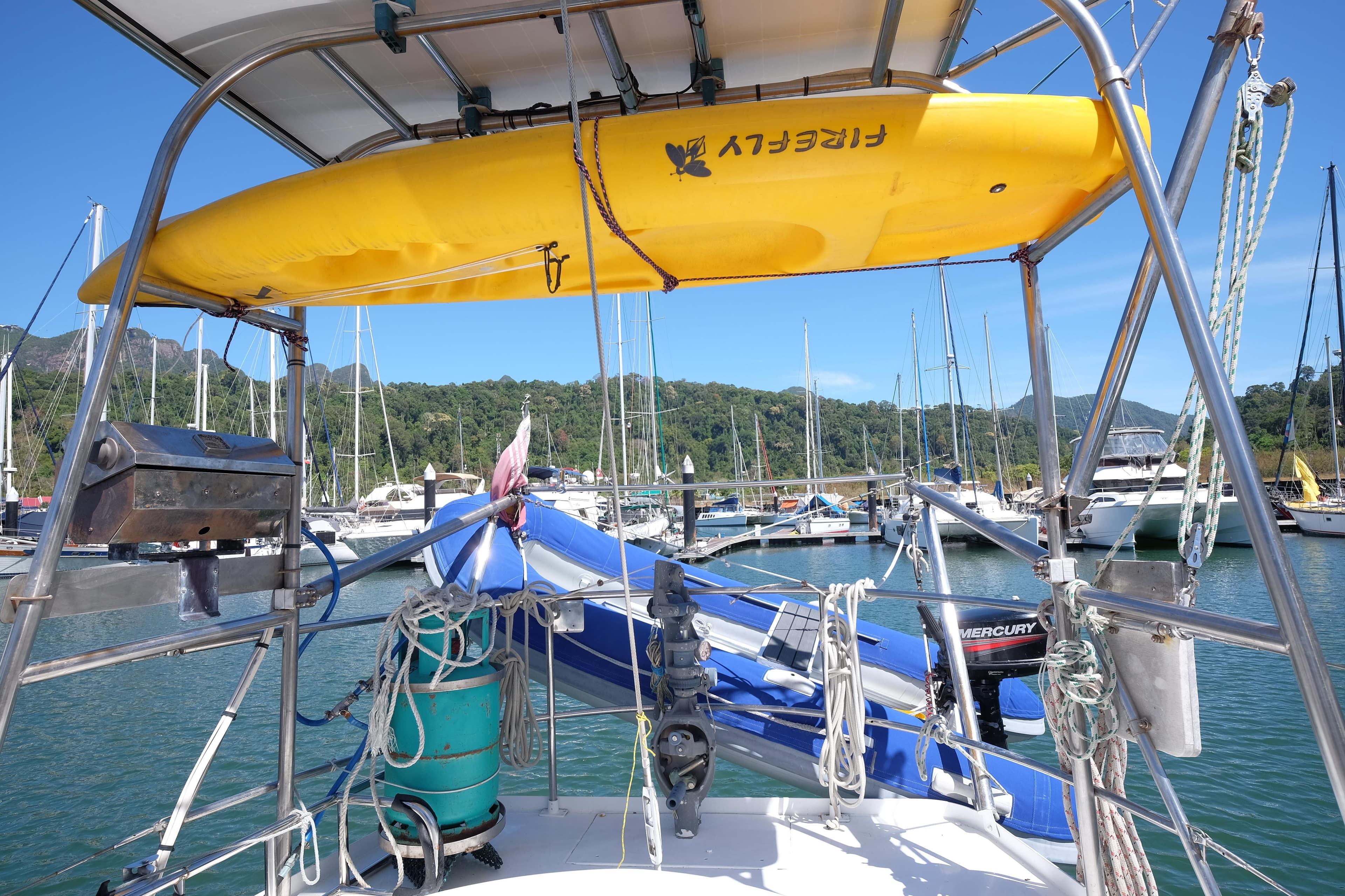 1981 Corbin 39 sailboat with yellow kayak, docked in a scenic marina.