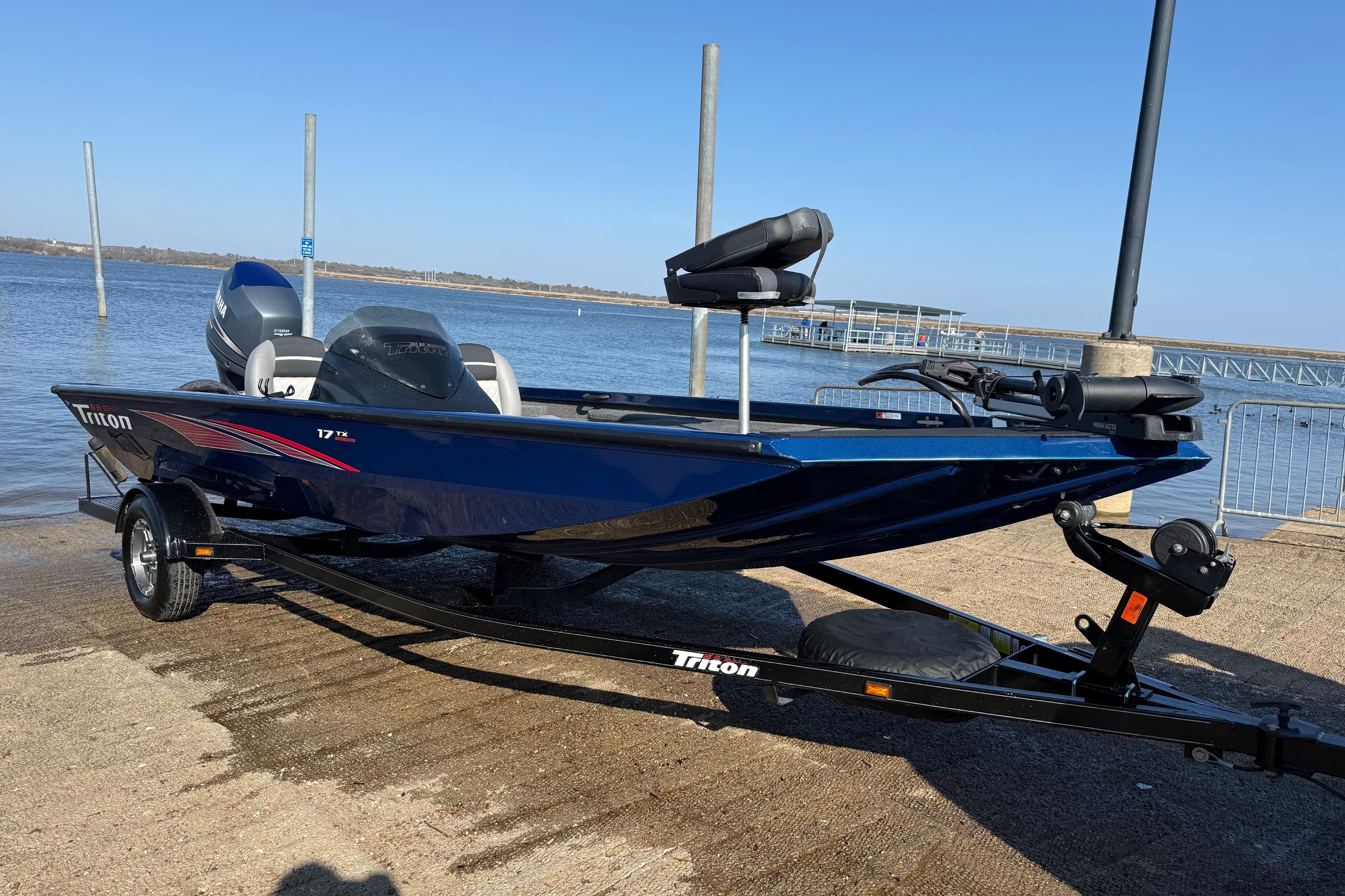 2020 Triton 17 TX boat on trailer by the water, ready for launch.