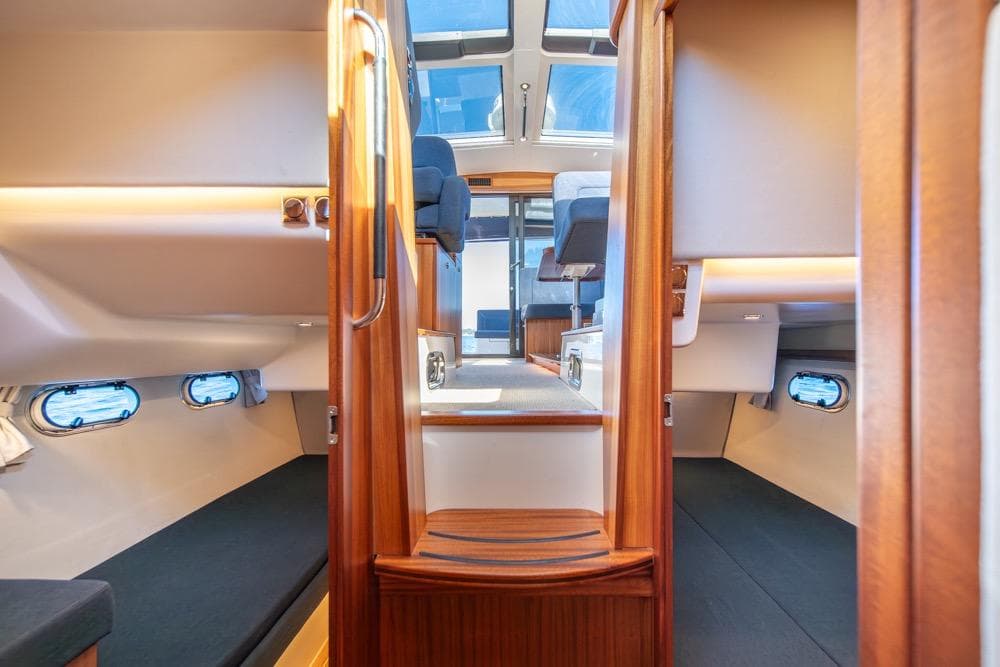 Interior of 2022 Nimbus 405 Coupé yacht, featuring cozy cabins and modern design.