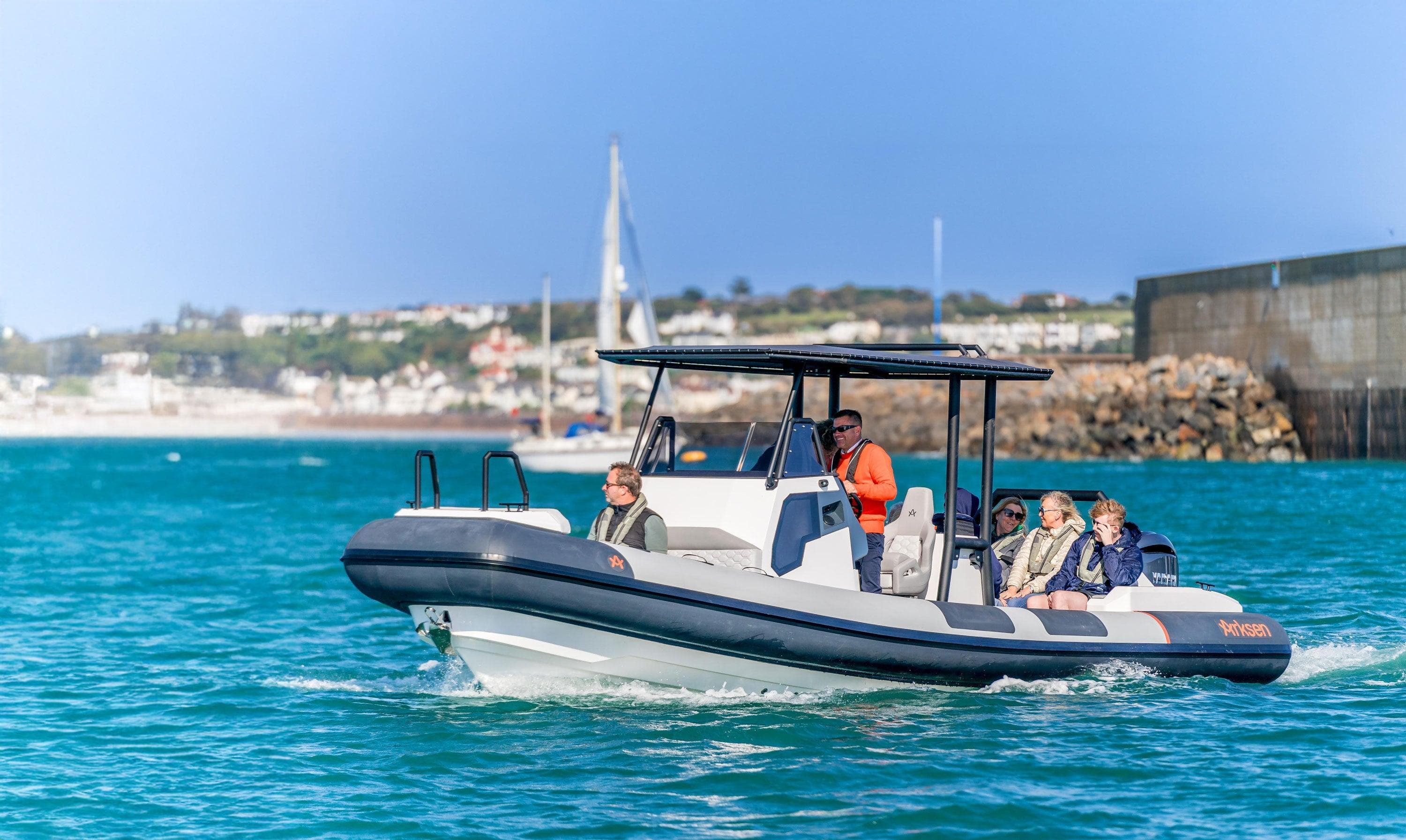 Arksen 8 boat cruising in clear blue waters, 2025 model.