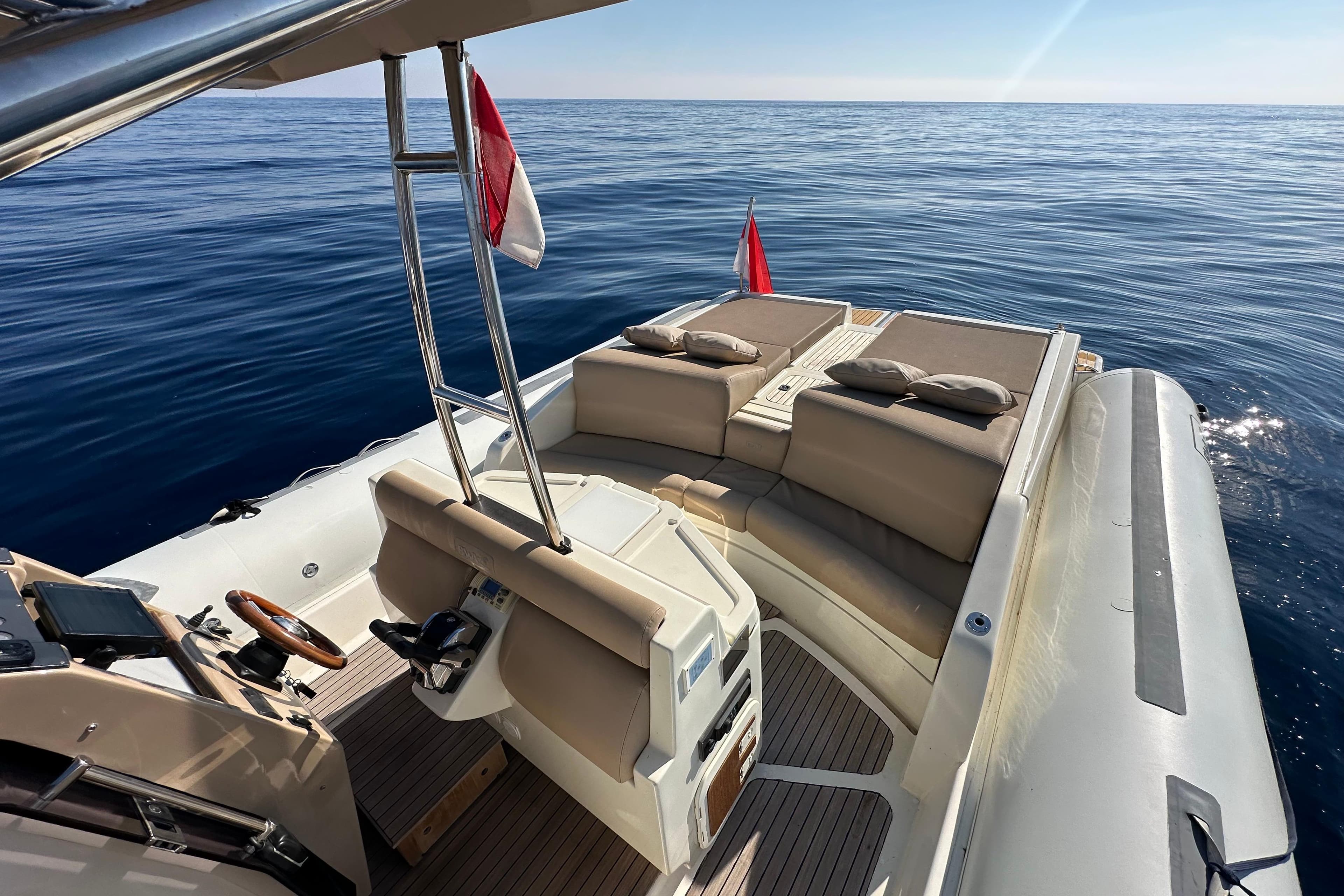Luxury BWA 44 yacht, 2006 model, with spacious seating, cruising on calm ocean waters.