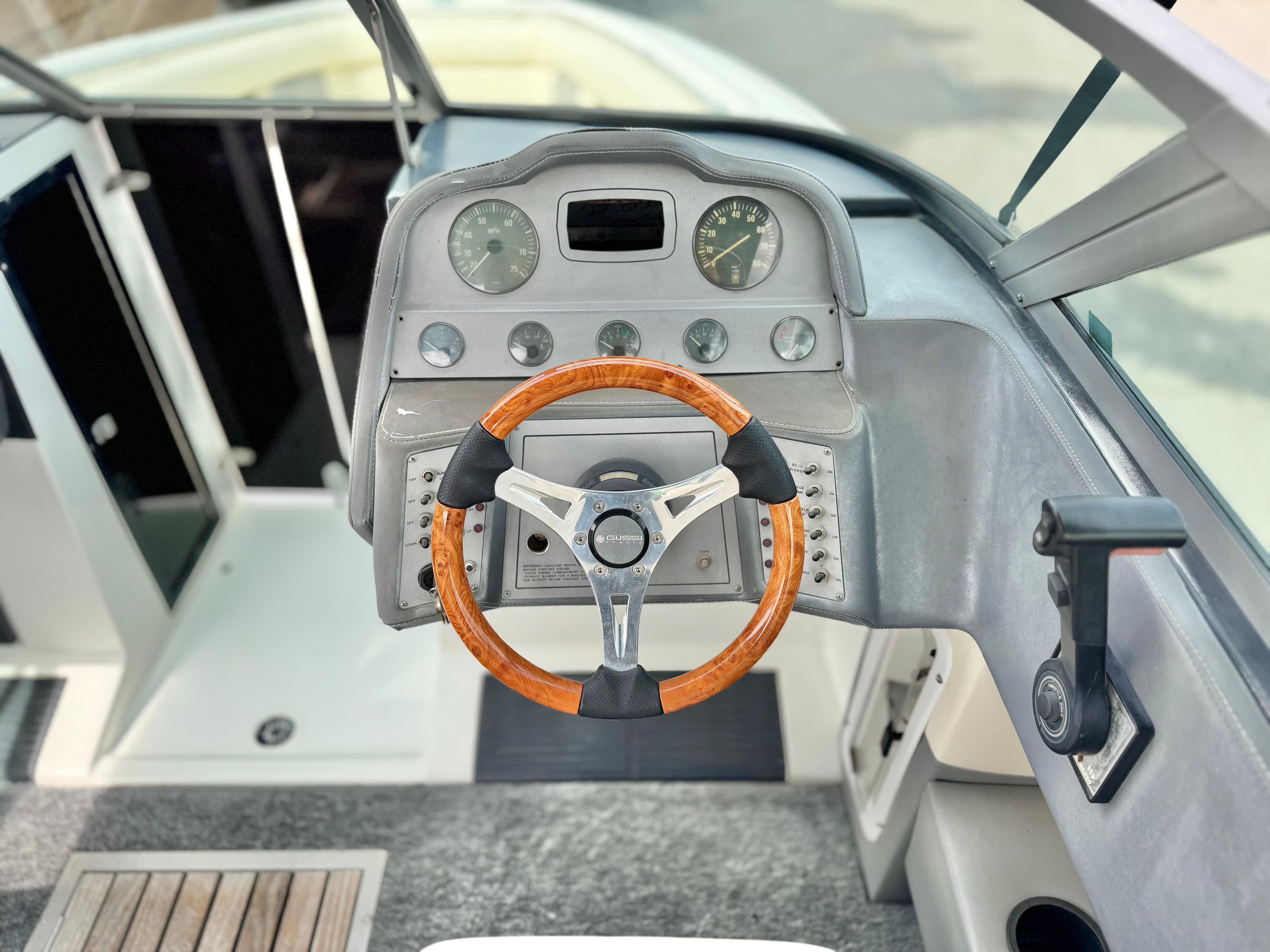 Steering wheel and dashboard of a 1994 Cobalt 222 boat, featuring classic design elements.