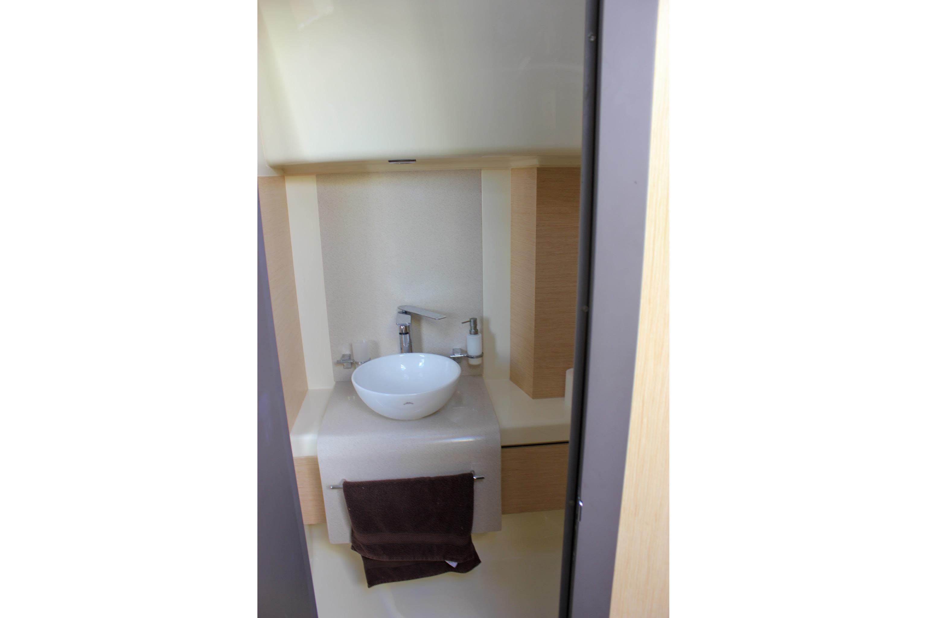 2017 Chris-Craft Launch 38 bathroom with modern sink and faucet.