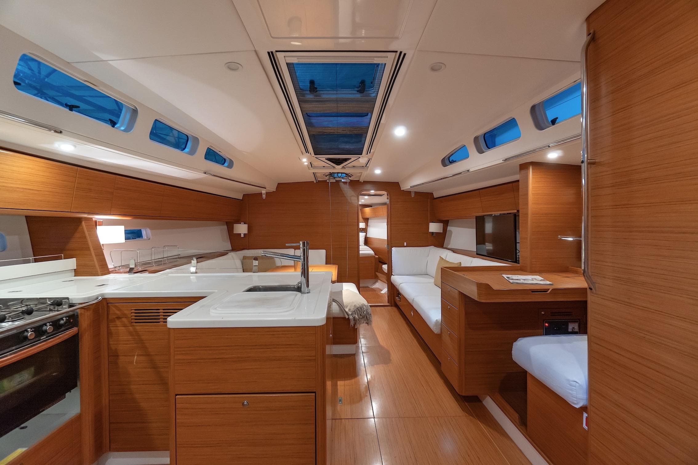 Luxurious interior of 2014 X-Yachts Xp 55 sailboat with modern wood finish and spacious layout.