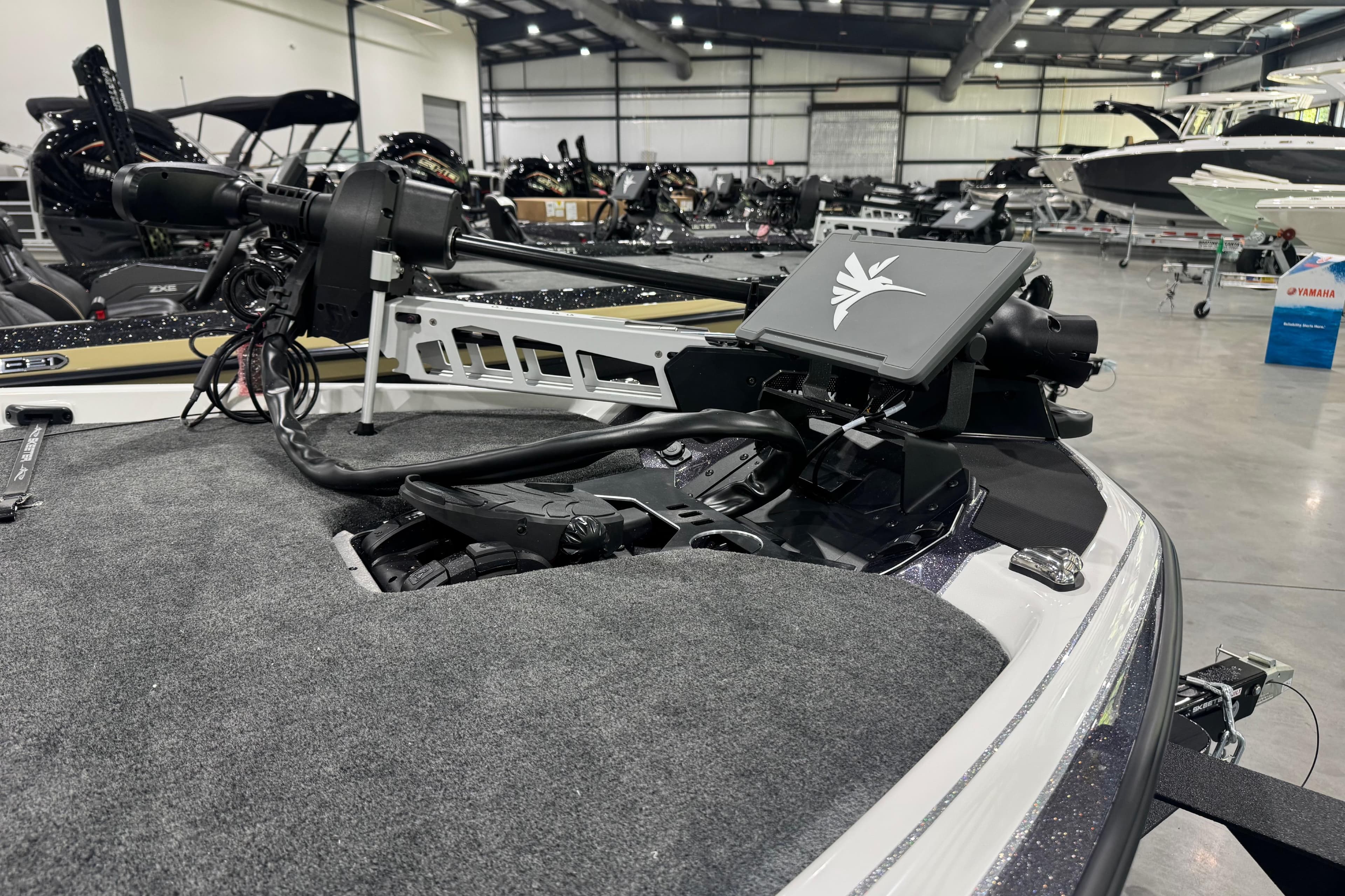 2026 Skeeter FXR20 FLEX boat with advanced trolling motor in a showroom.