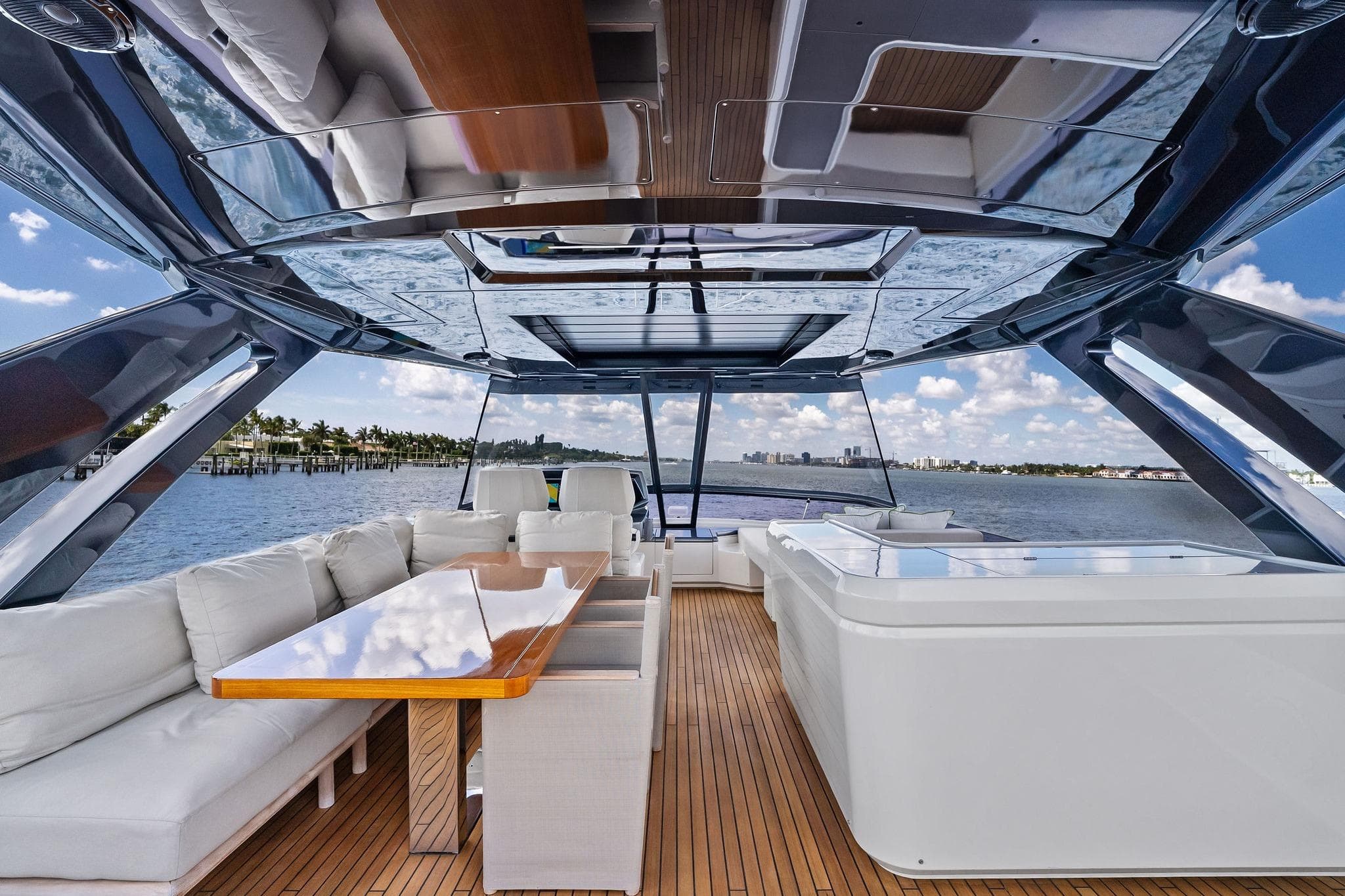 Luxurious 2022 Ferretti Yachts 780 interior with elegant seating and panoramic ocean view.