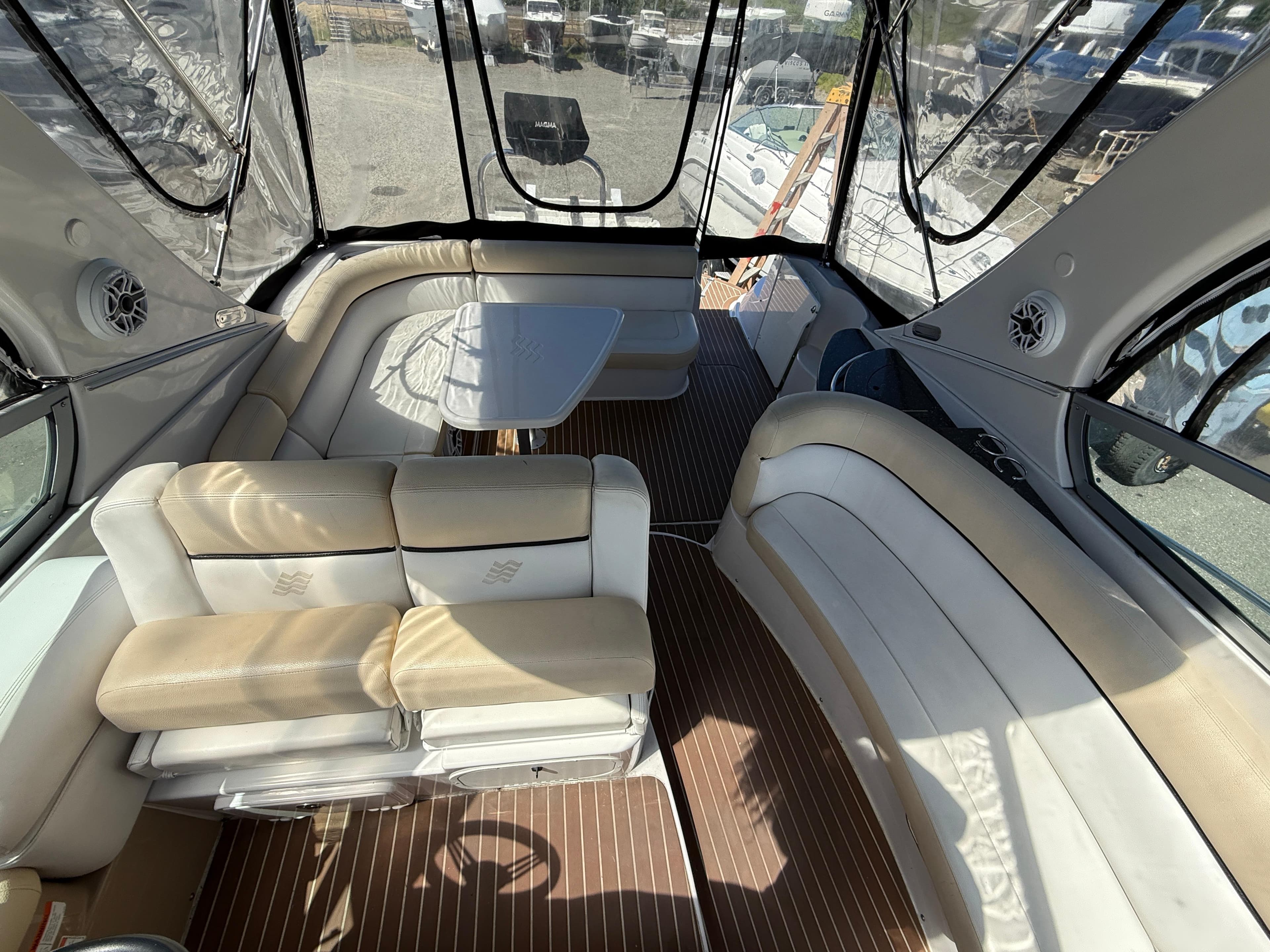 2008 Four Winns V358 boat interior with beige seating and wooden flooring.