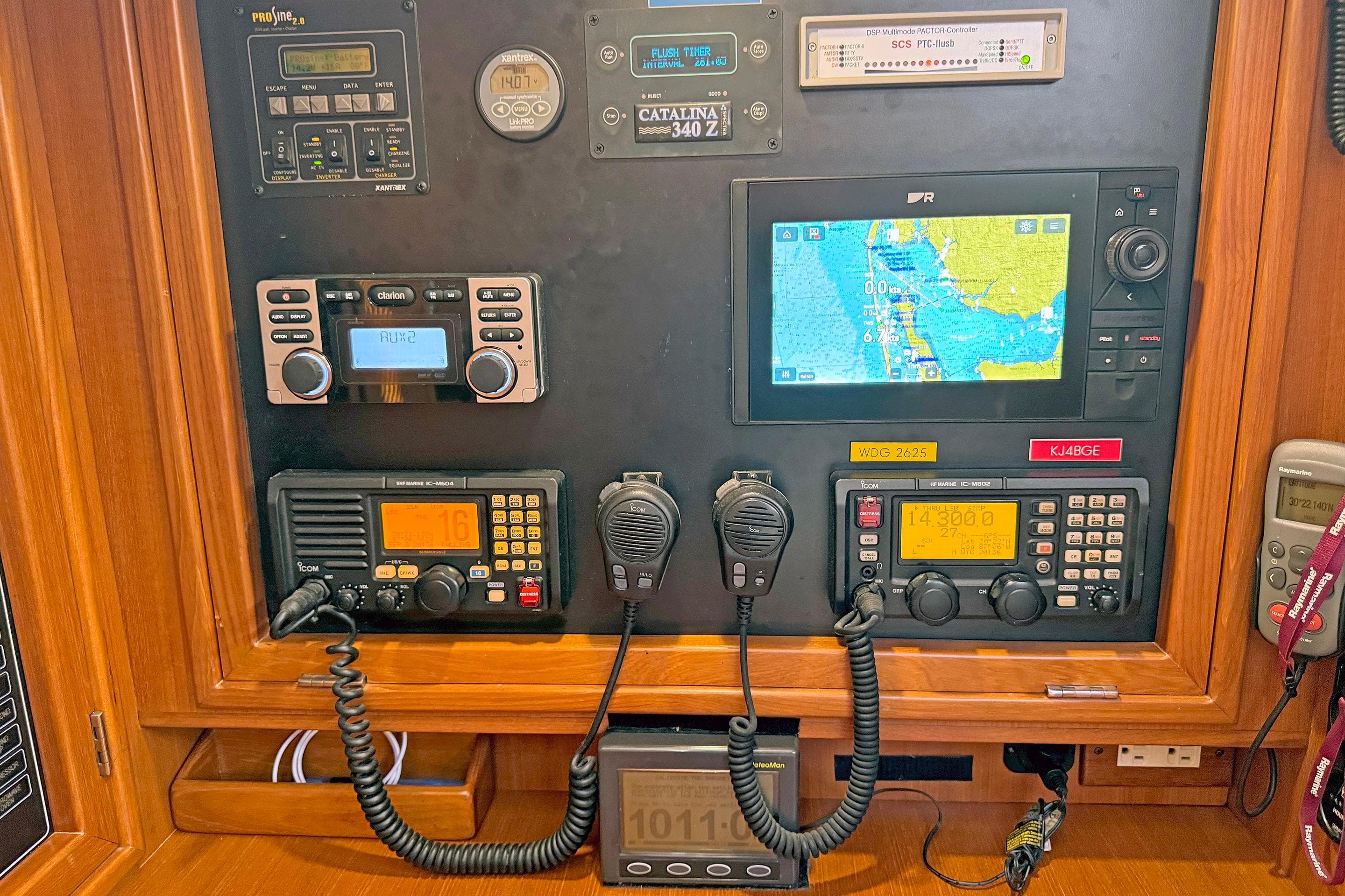 Control panel of a 2012 Hylas 49CC yacht with navigation and communication equipment.