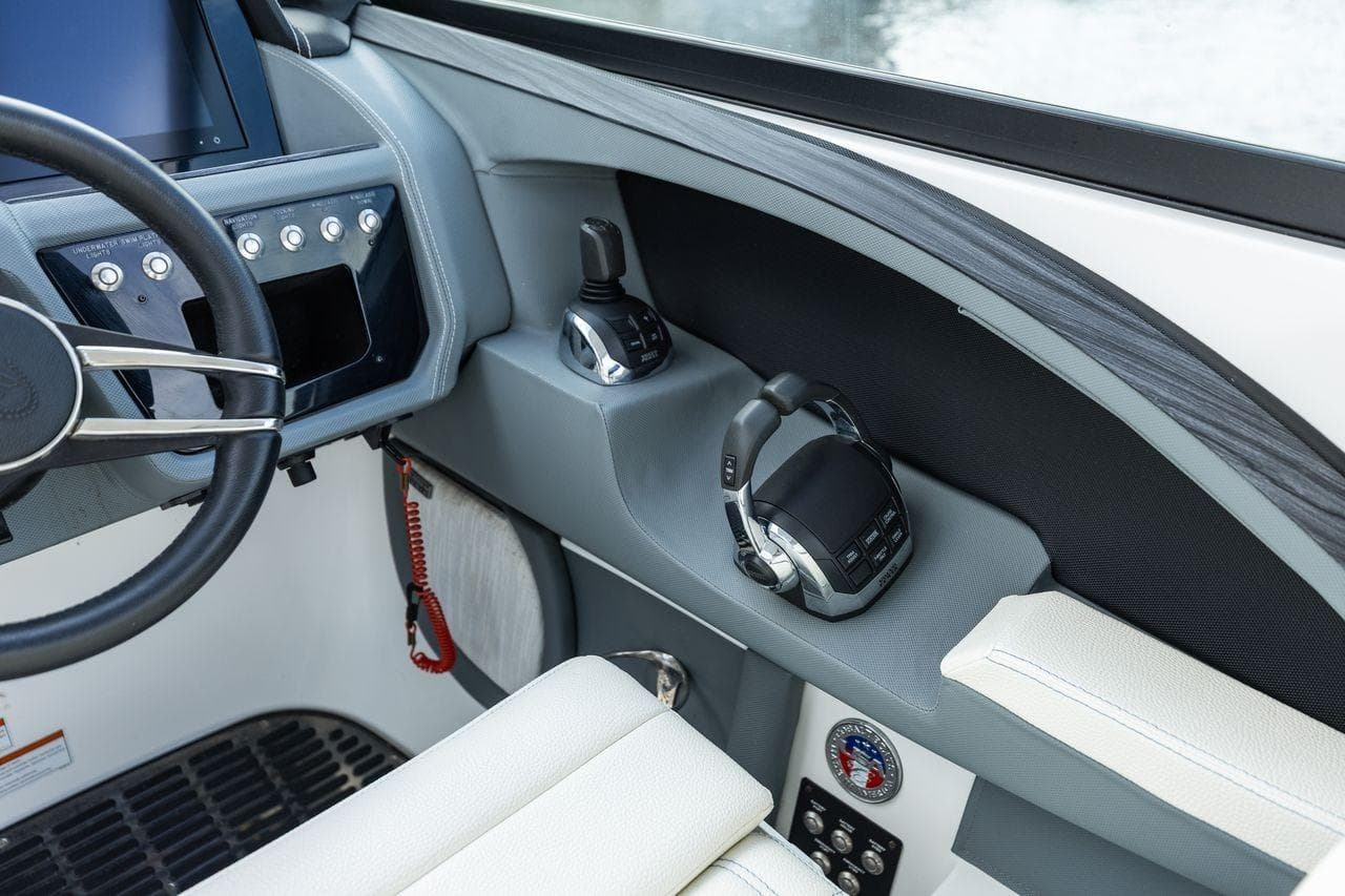 2021 Cobalt R30 boat helm with steering wheel and control panel.