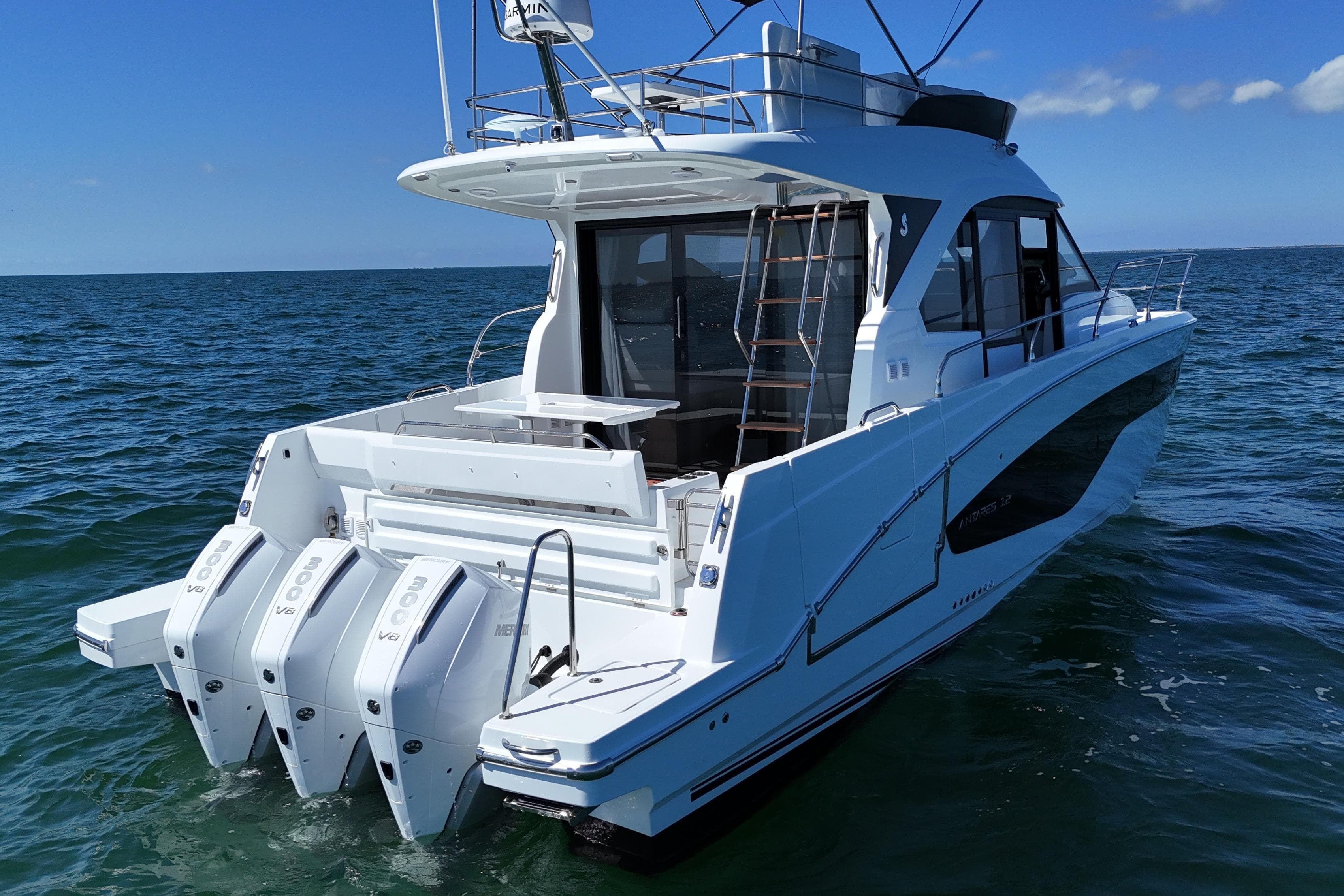 2026 Beneteau Antares 12 yacht with triple outboard engines on open water.
