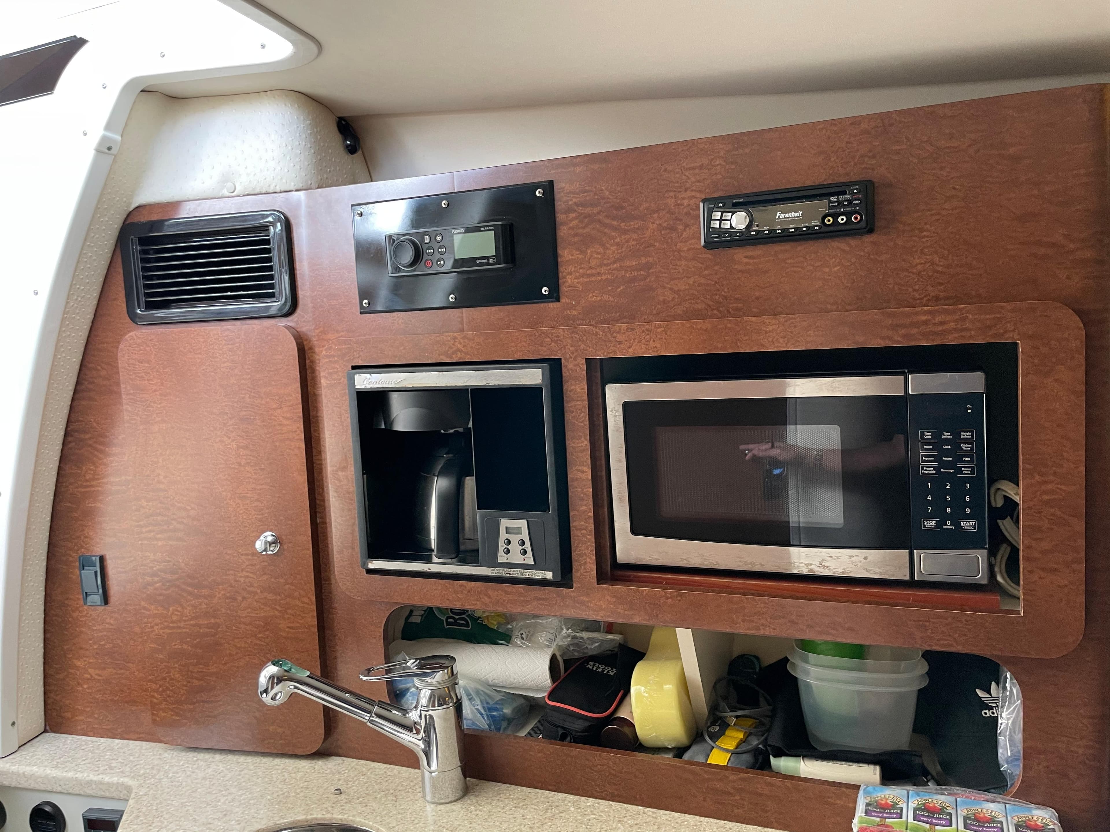 2008 Hydra-Sports 3500VX interior kitchen with microwave, coffee maker, and sink.