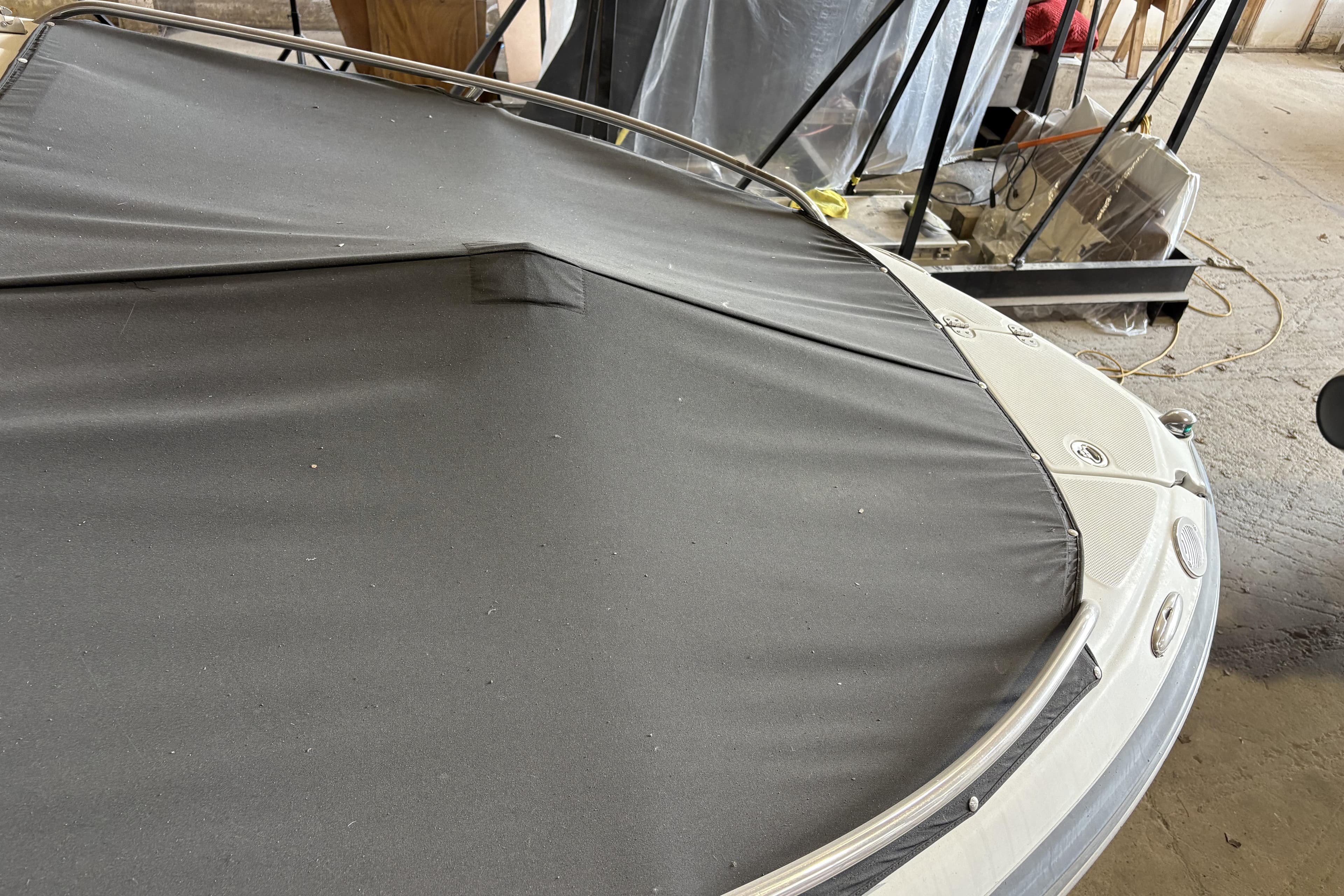 2007 Crownline 220 LS boat with a protective cover in a storage area.