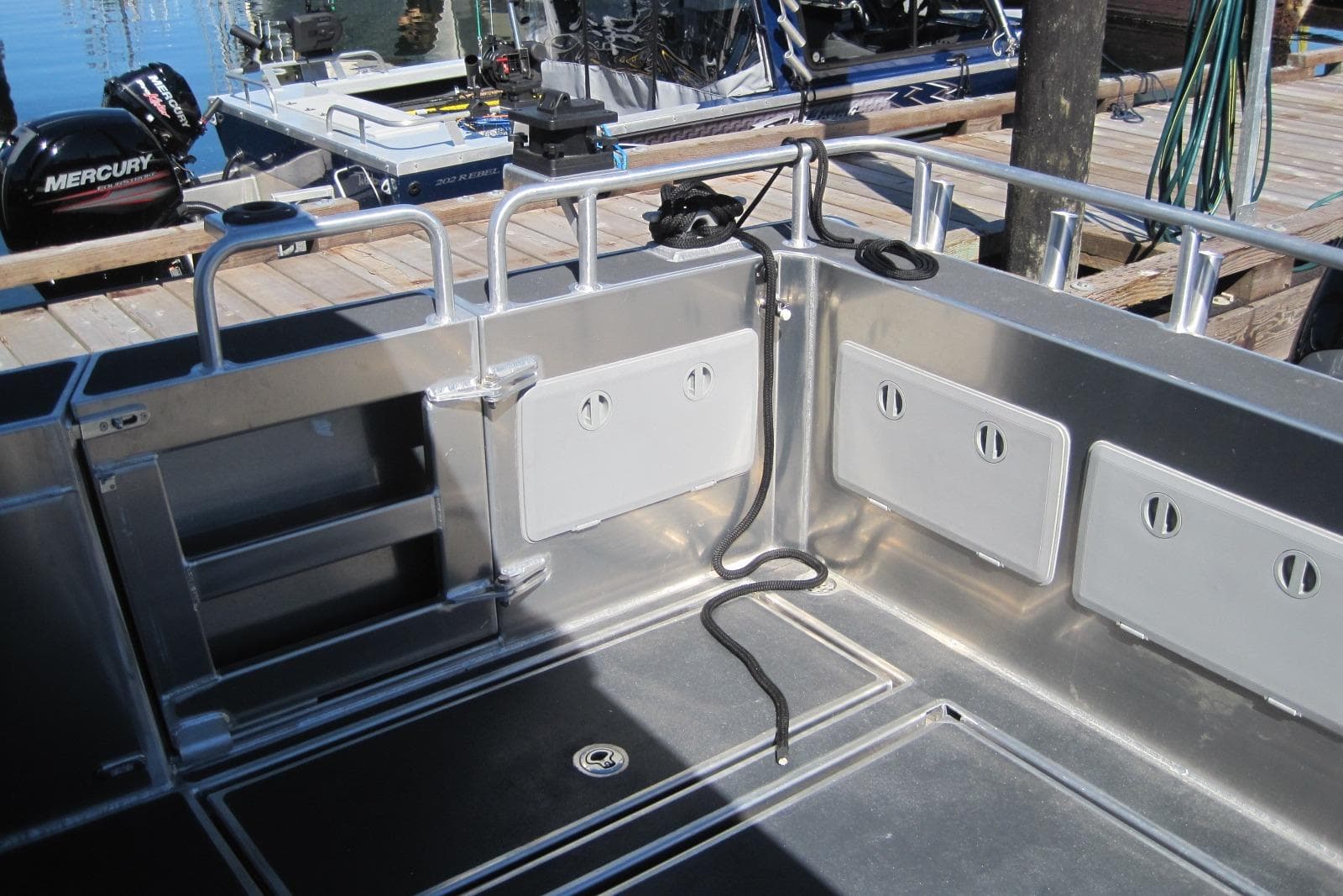 2020 EagleCraft 36' Cruiser boat deck with storage compartments and railing.