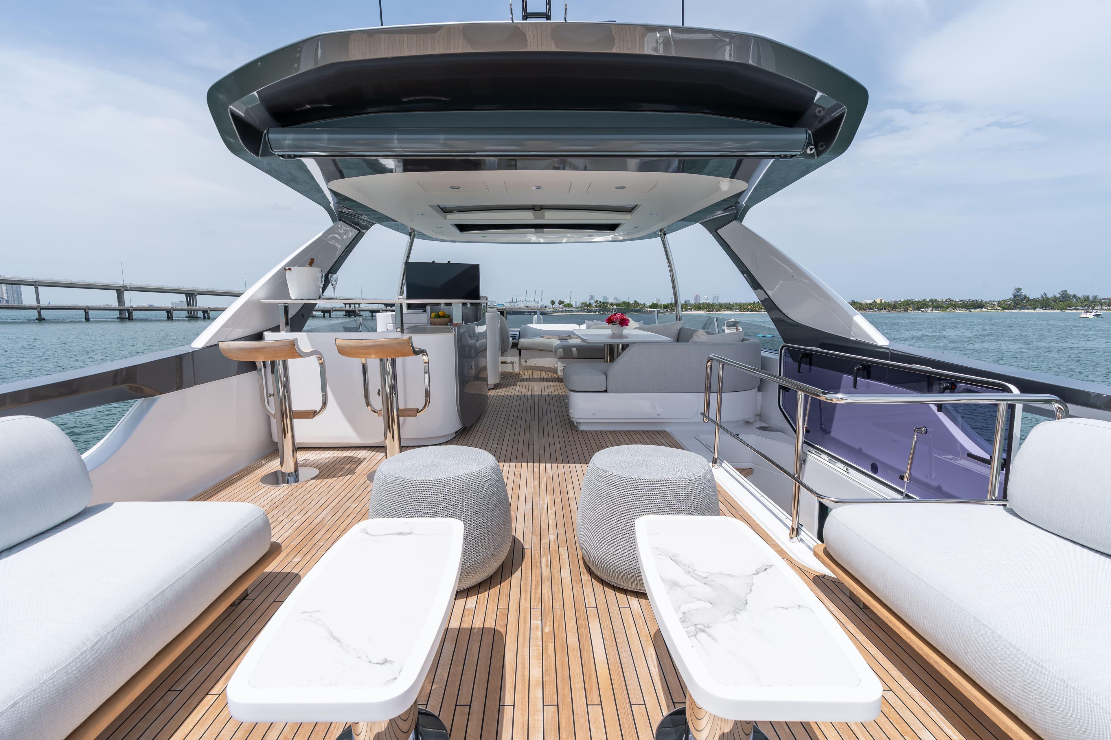 Luxurious 2022 Azimut 78 yacht deck with modern seating and ocean view.