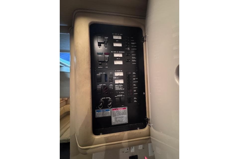 Electrical panel inside 1998 Sea Ray Sundancer 330 yacht cabin.