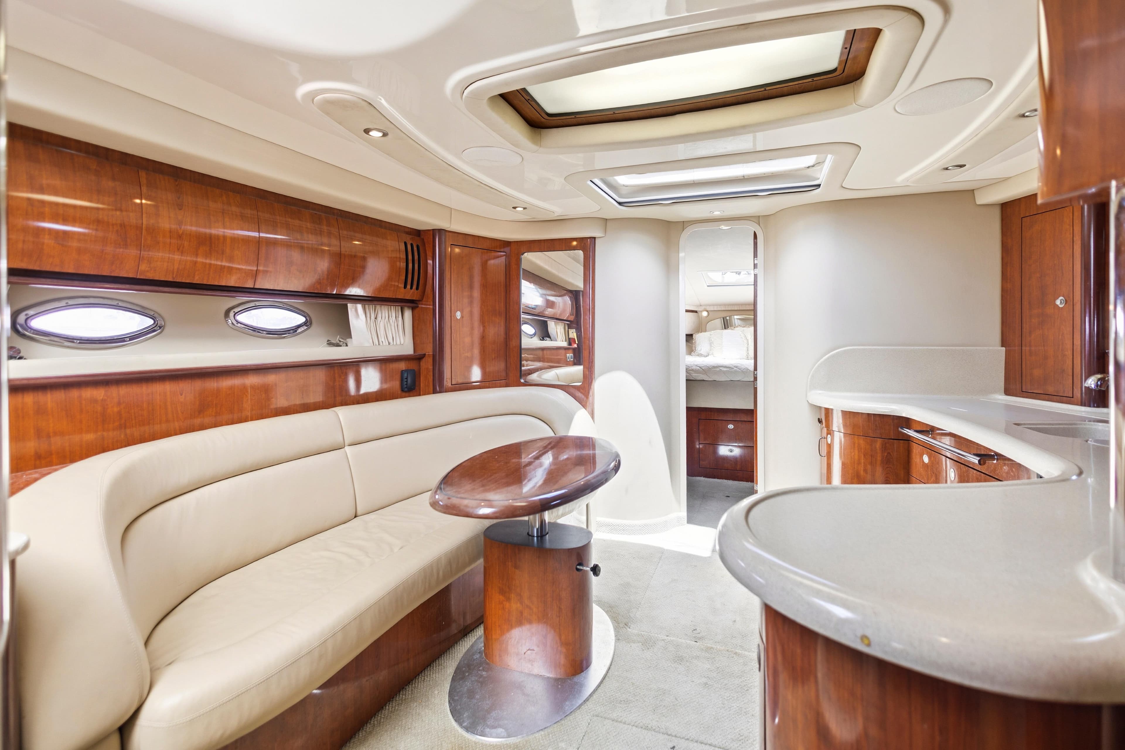 Luxurious interior of 2004 Sea Ray 420 Sundancer yacht with elegant wood finishes.