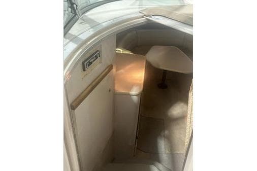 1998 Cruisers 3175 boat interior with seating and table.