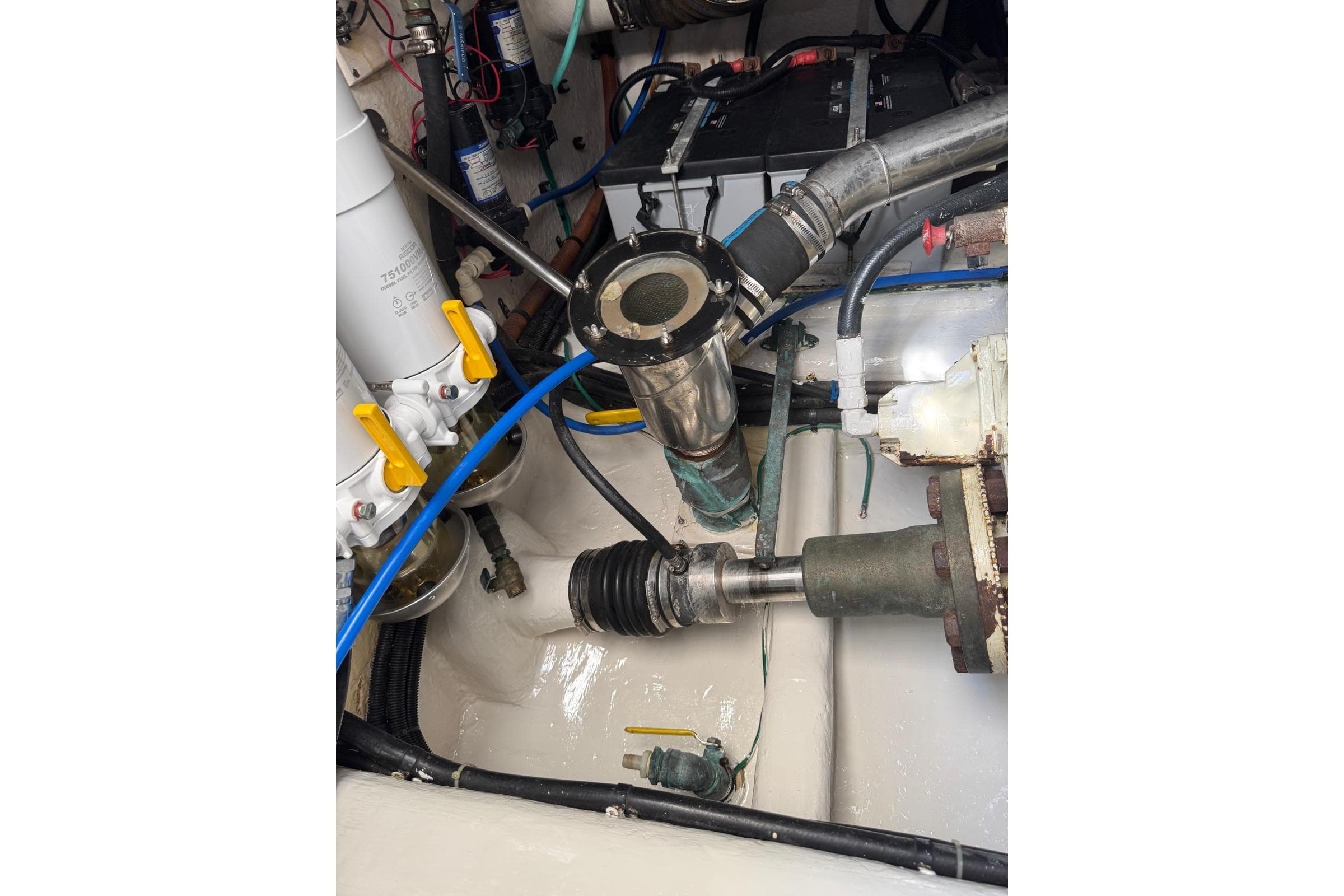 Engine room of 2004 Riviera 51 Flybridge with visible mechanical components.
