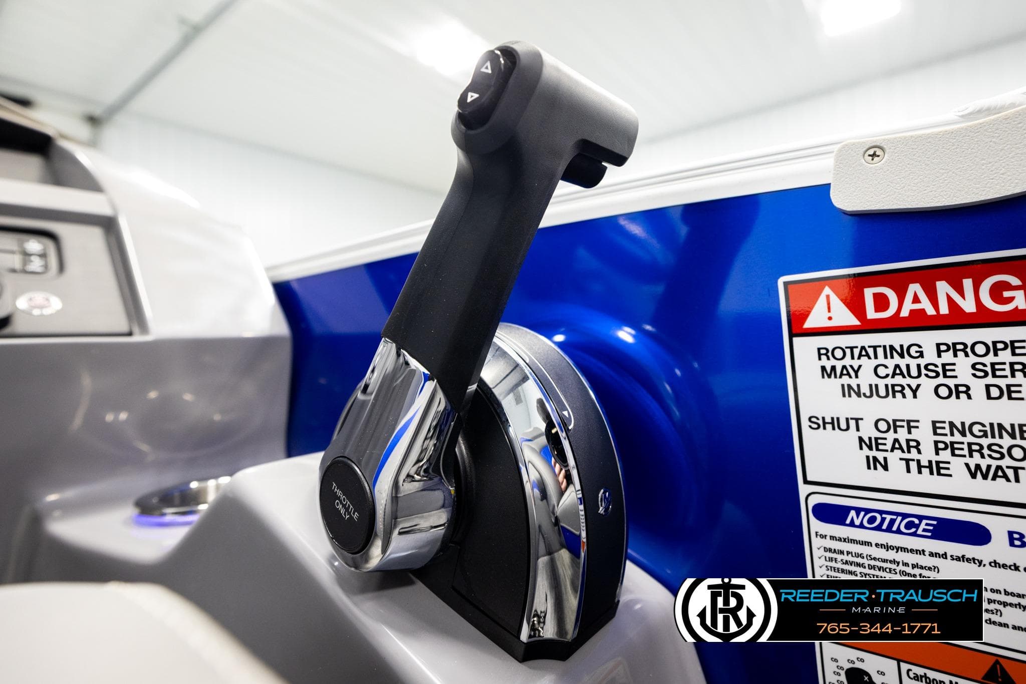 Close-up of 2025 Bennington LTFBSE throttle control with safety warning label.