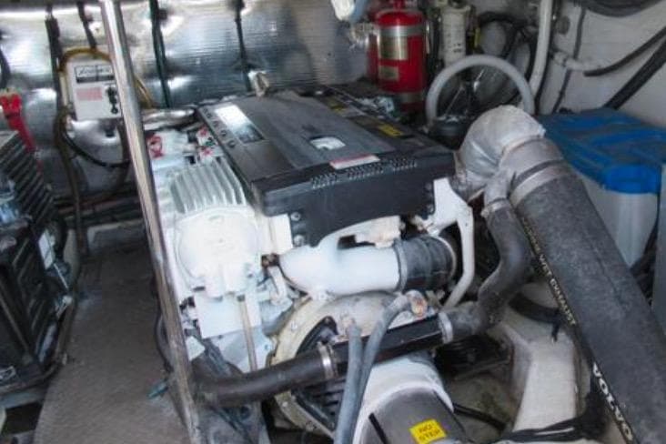 Engine room of 2012 Regal 42 Sport Coupe with visible components and fire extinguisher.