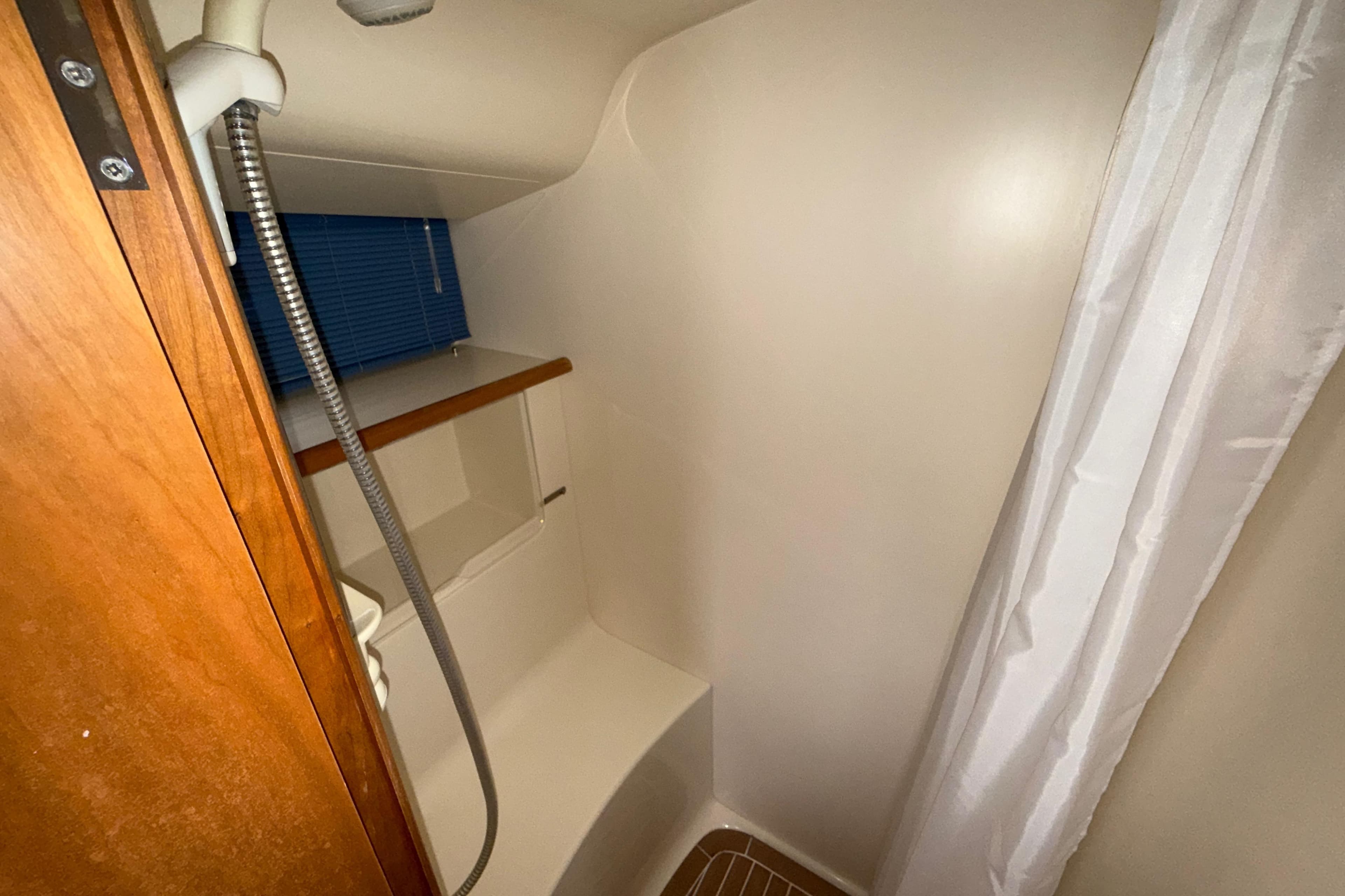 Compact bathroom with shower in 2004 Broom 42 CL boat.