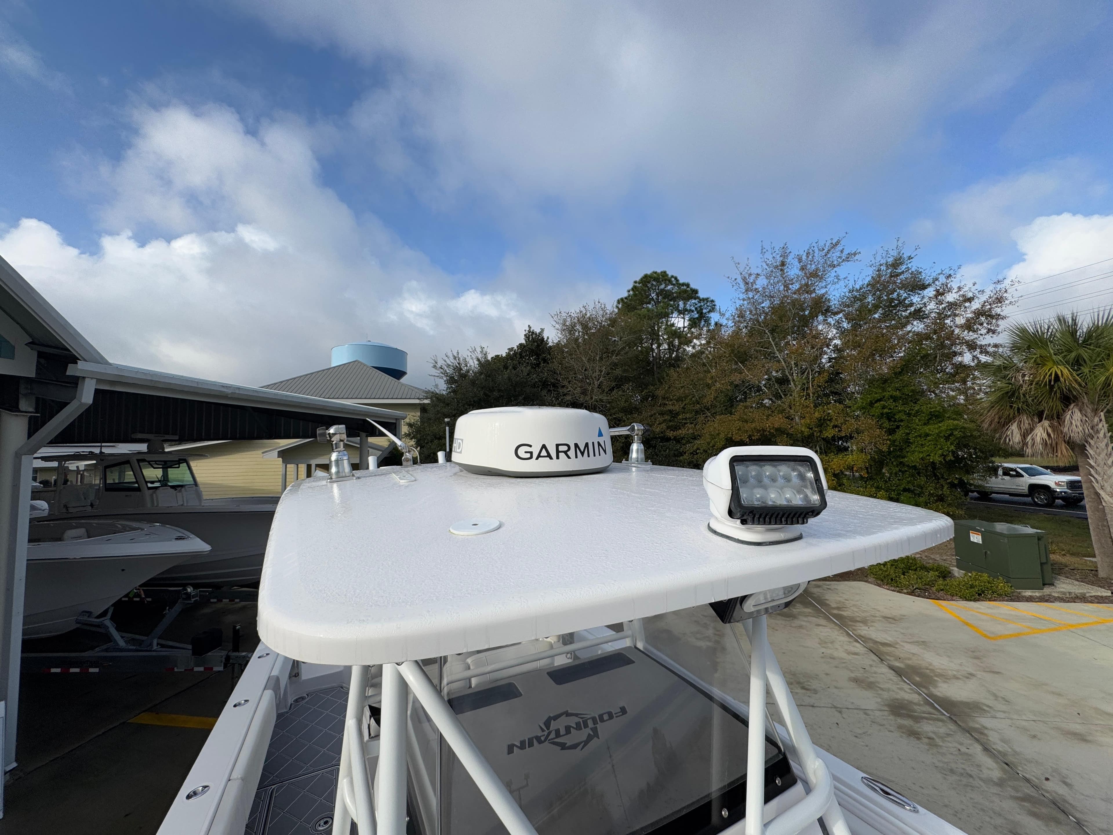 2018 Fountain 34 CC boat with Garmin radar and spotlight on deck.