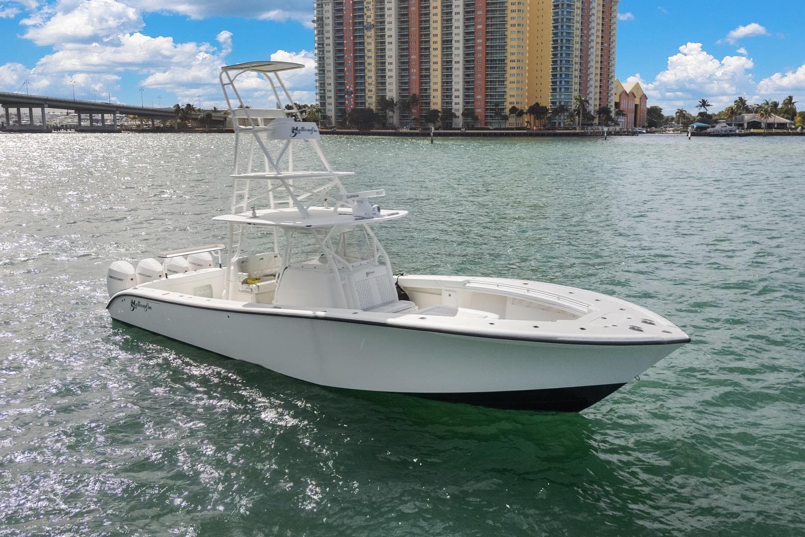 2015 Yellowfin 39 Offshore boat on water with cityscape background.