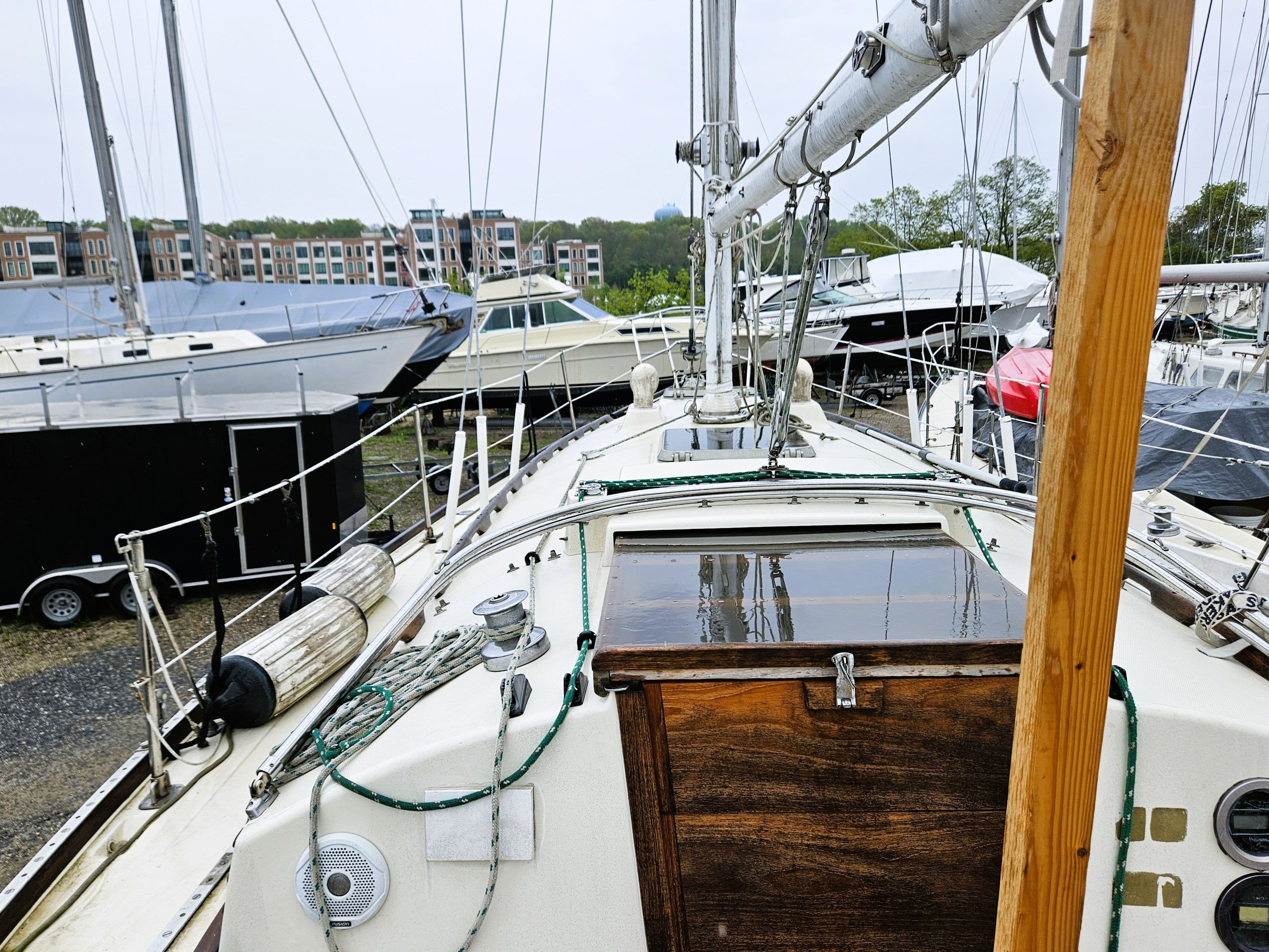 1985 Sabre 34 sailboat docked among other yachts.
