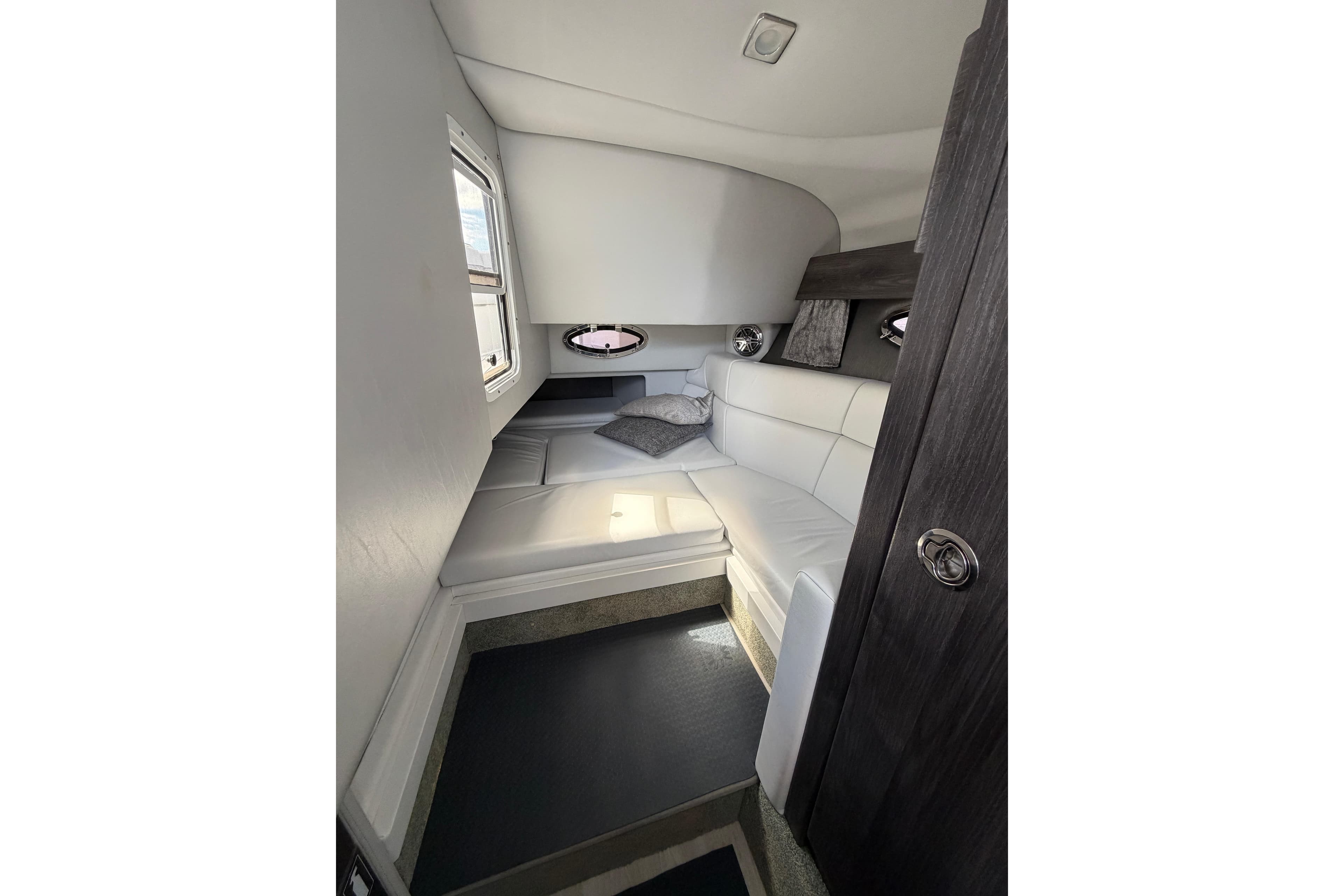 2020 Formula 330 Crossover Bowrider OB cabin interior with white seating and modern design.