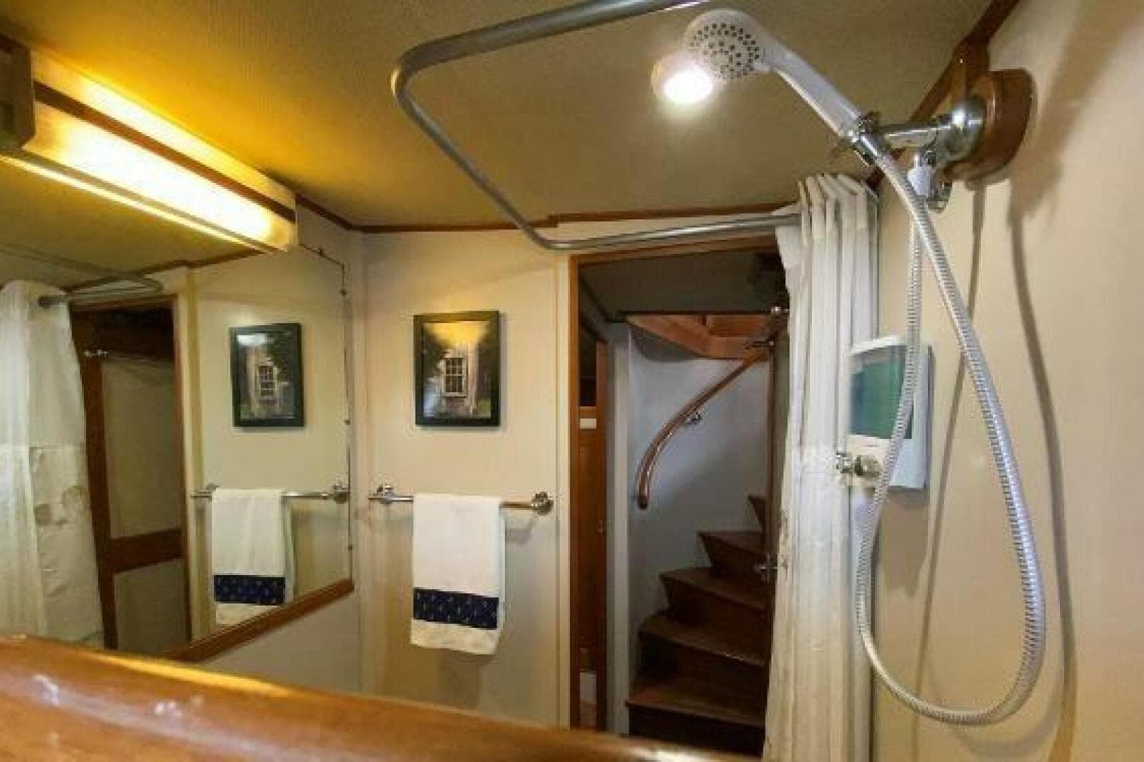 Bathroom interior of 1973 Grand Banks 49 Alaskan yacht with shower and towels.