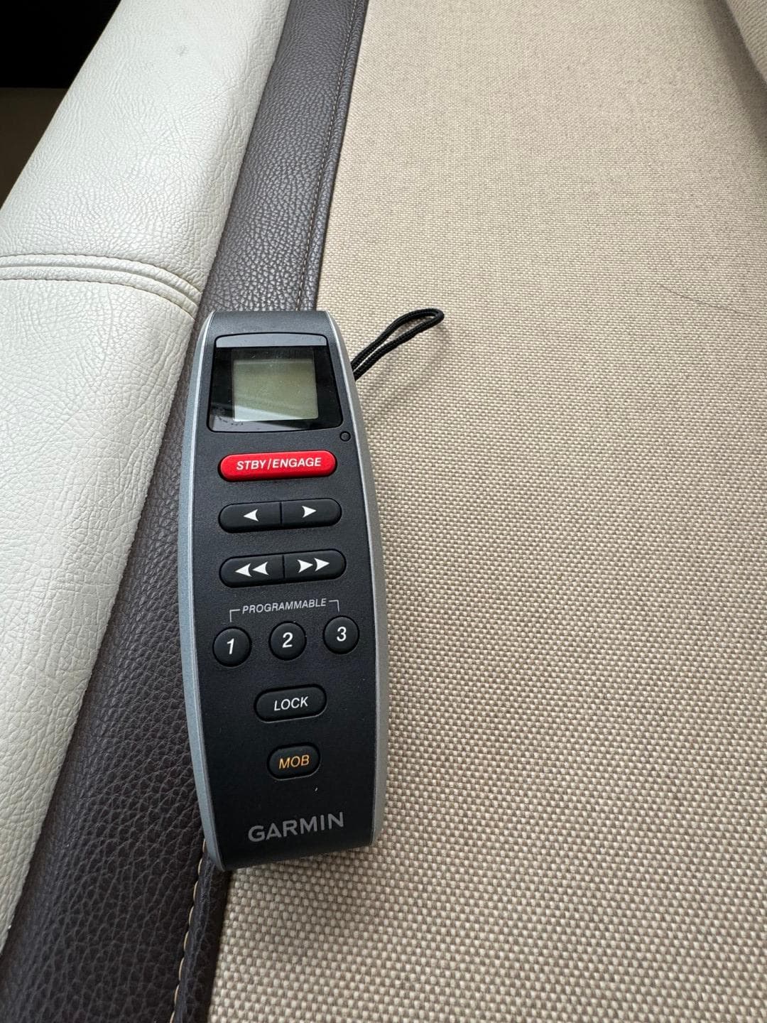 Garmin remote control on a beige and brown surface, Cutwater C28, 2017 model.