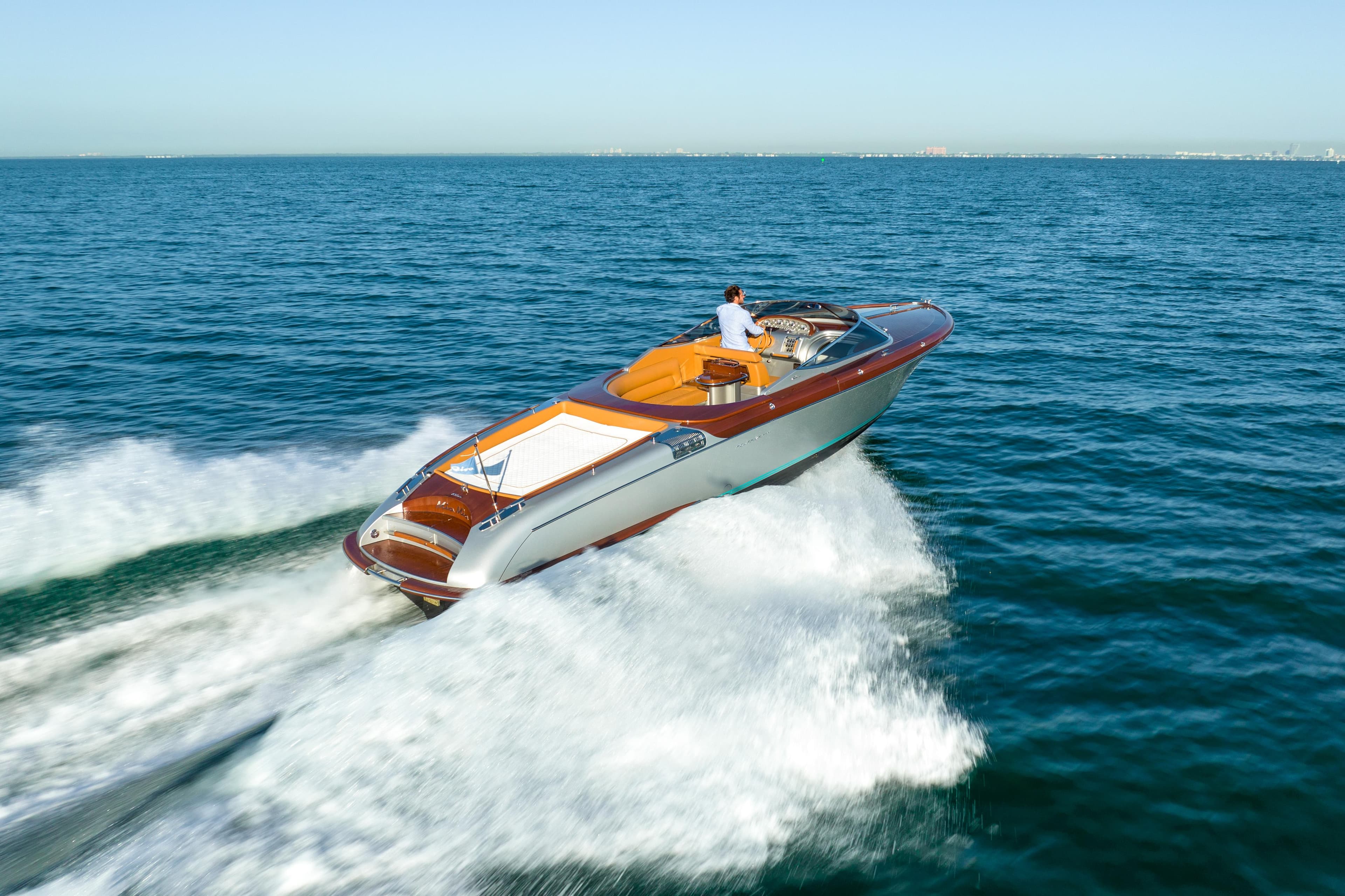 2020 Riva Aquariva Super luxury speedboat cruising on open water.