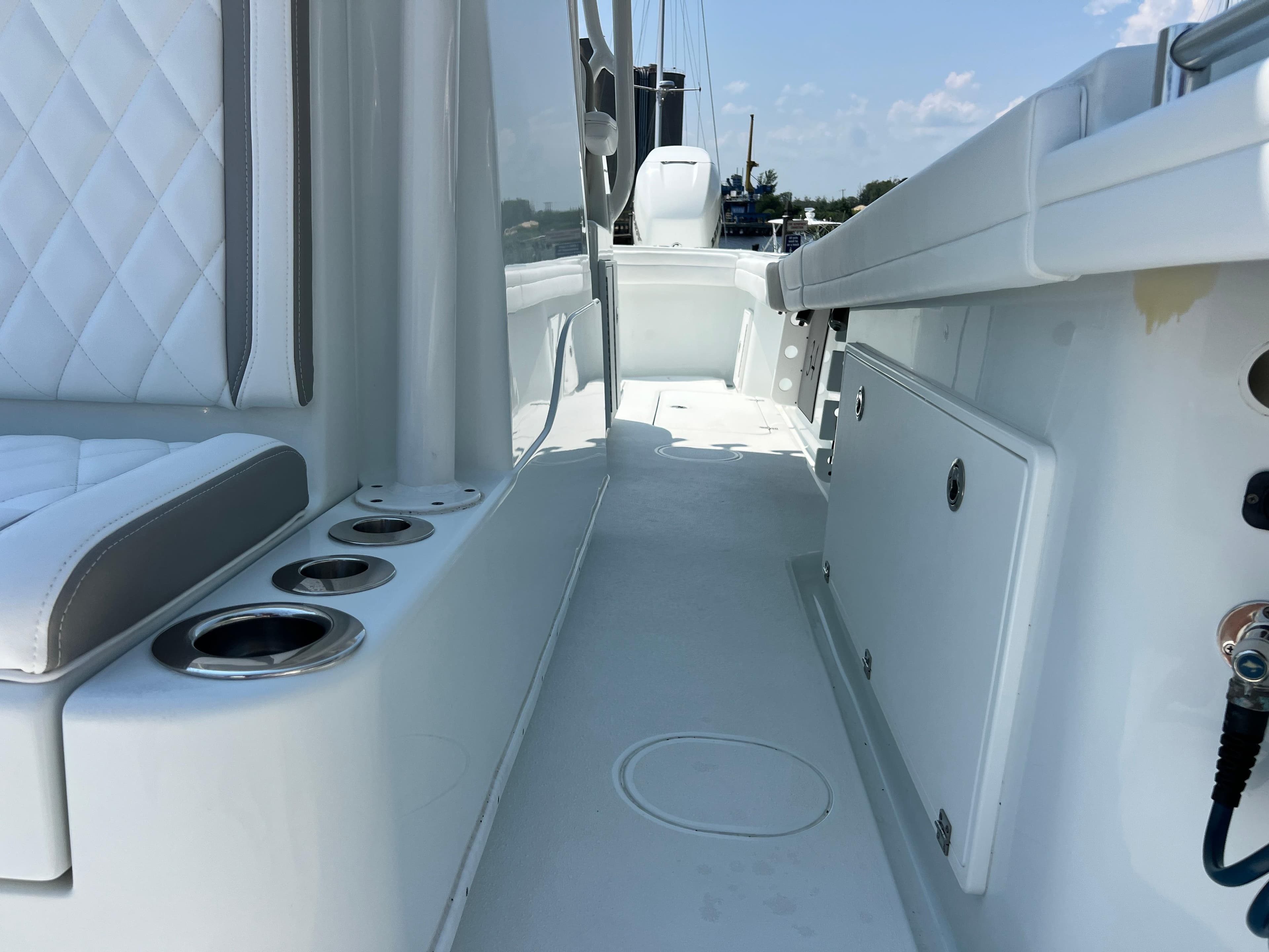 2022 Yellowfin 34 boat interior with white seating and storage compartments.