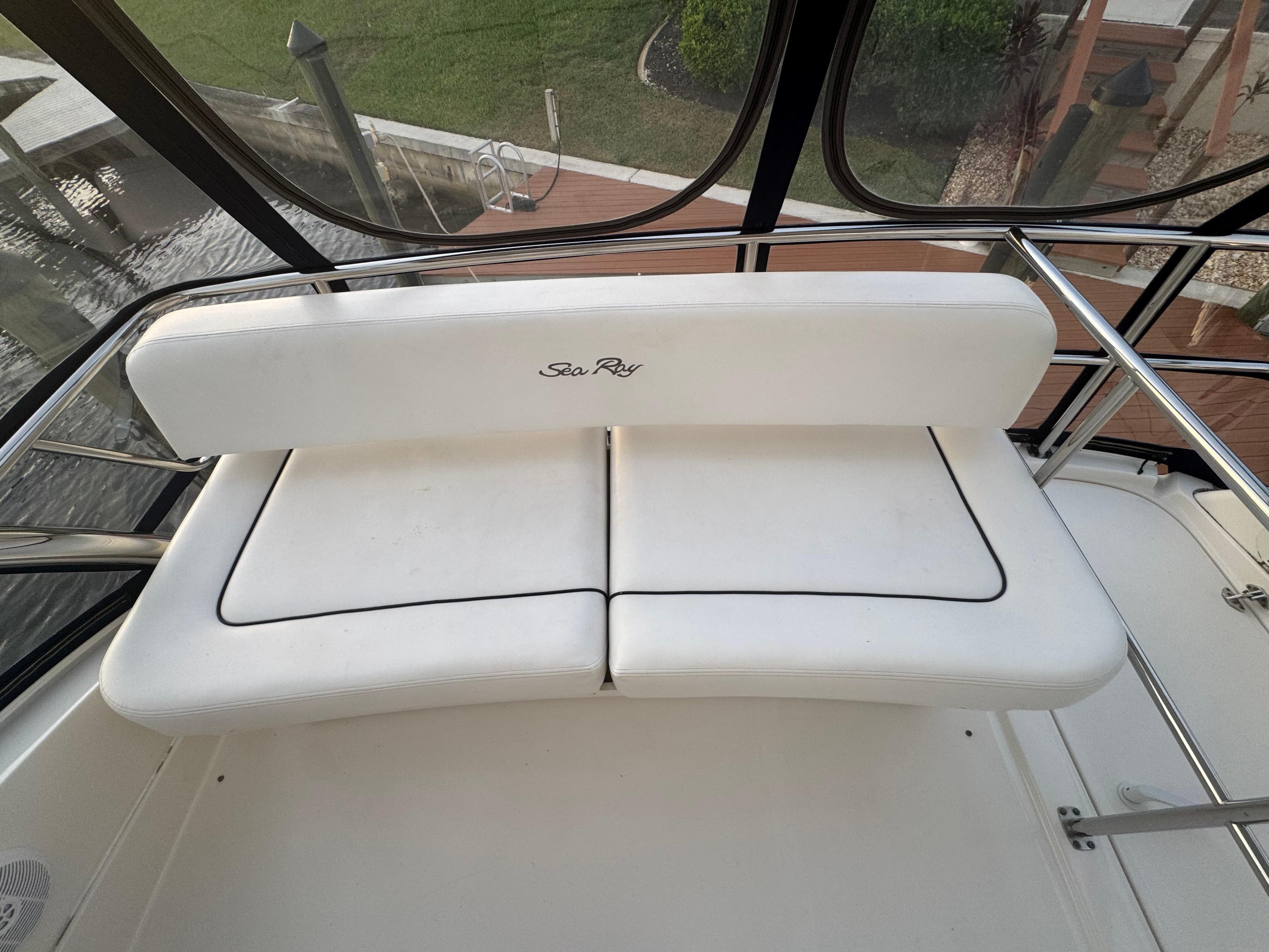 White seating on 2007 Sea Ray 52 Sedan Bridge yacht, featuring sleek design and waterfront view.