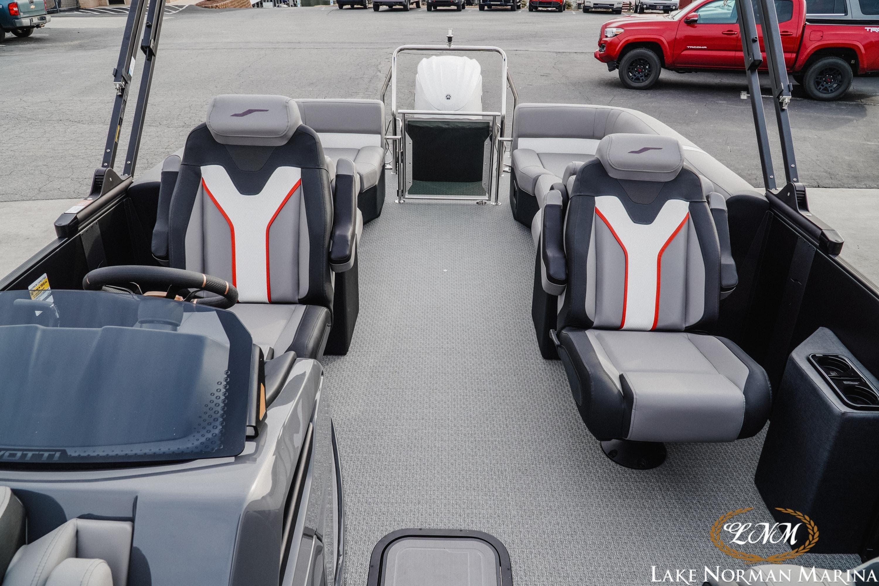Evotti 723QL 2026 boat interior with modern seating and steering wheel at Lake Norman Marina.