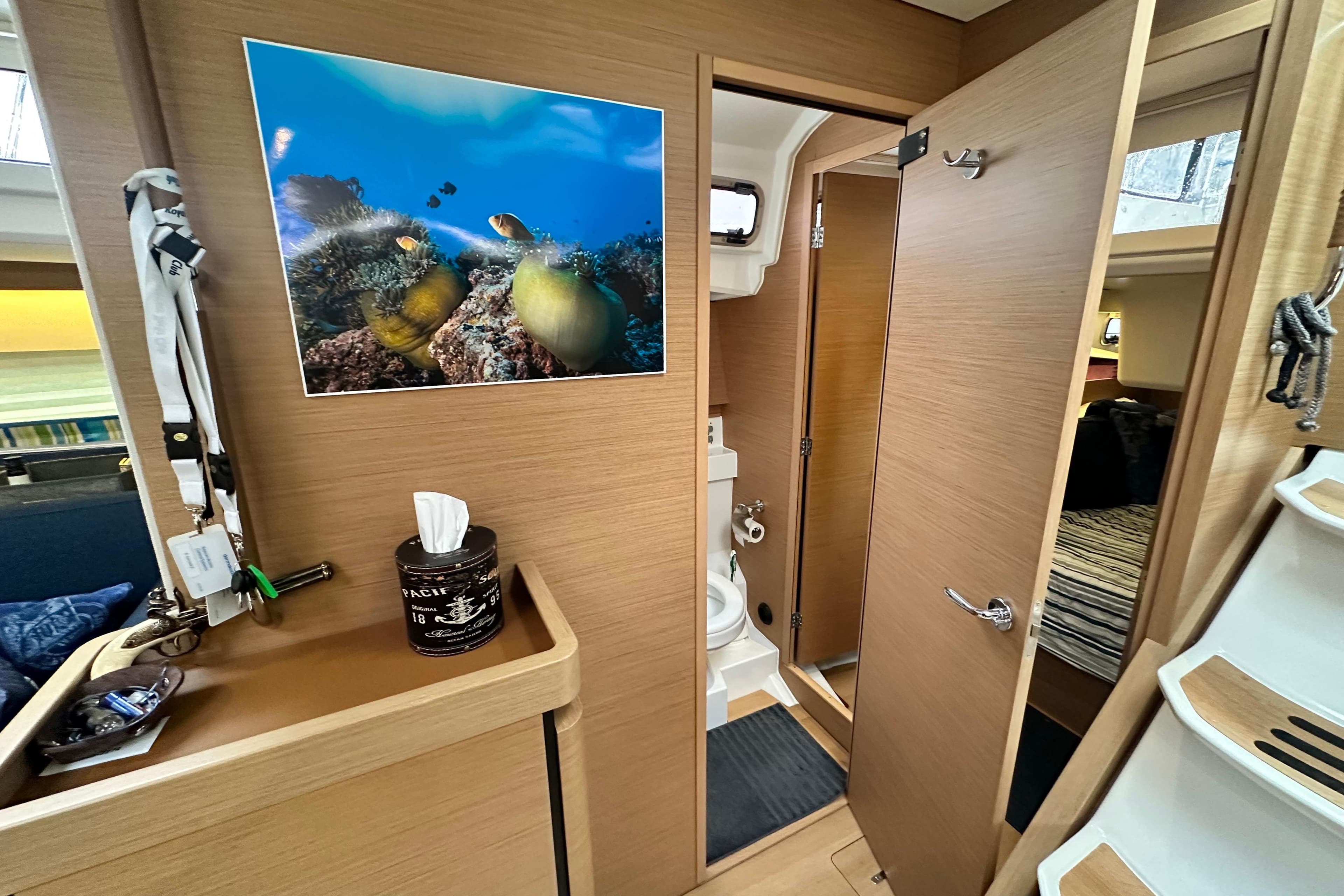Interior of 2020 Jeanneau Sun Odyssey 440 yacht with bathroom and marine decor.