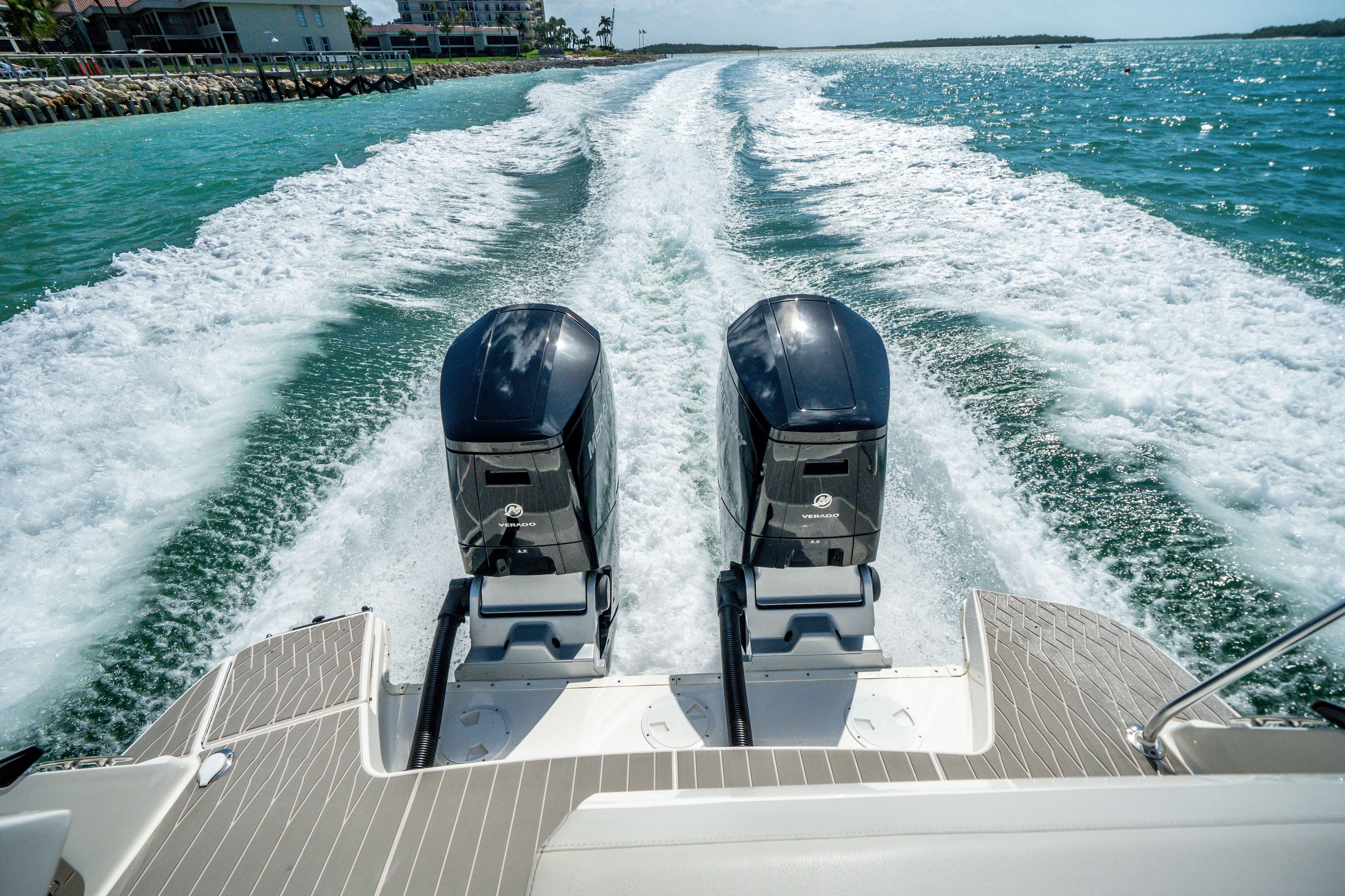 2025 Sea Ray 370 DA OB with twin outboard engines on the water.